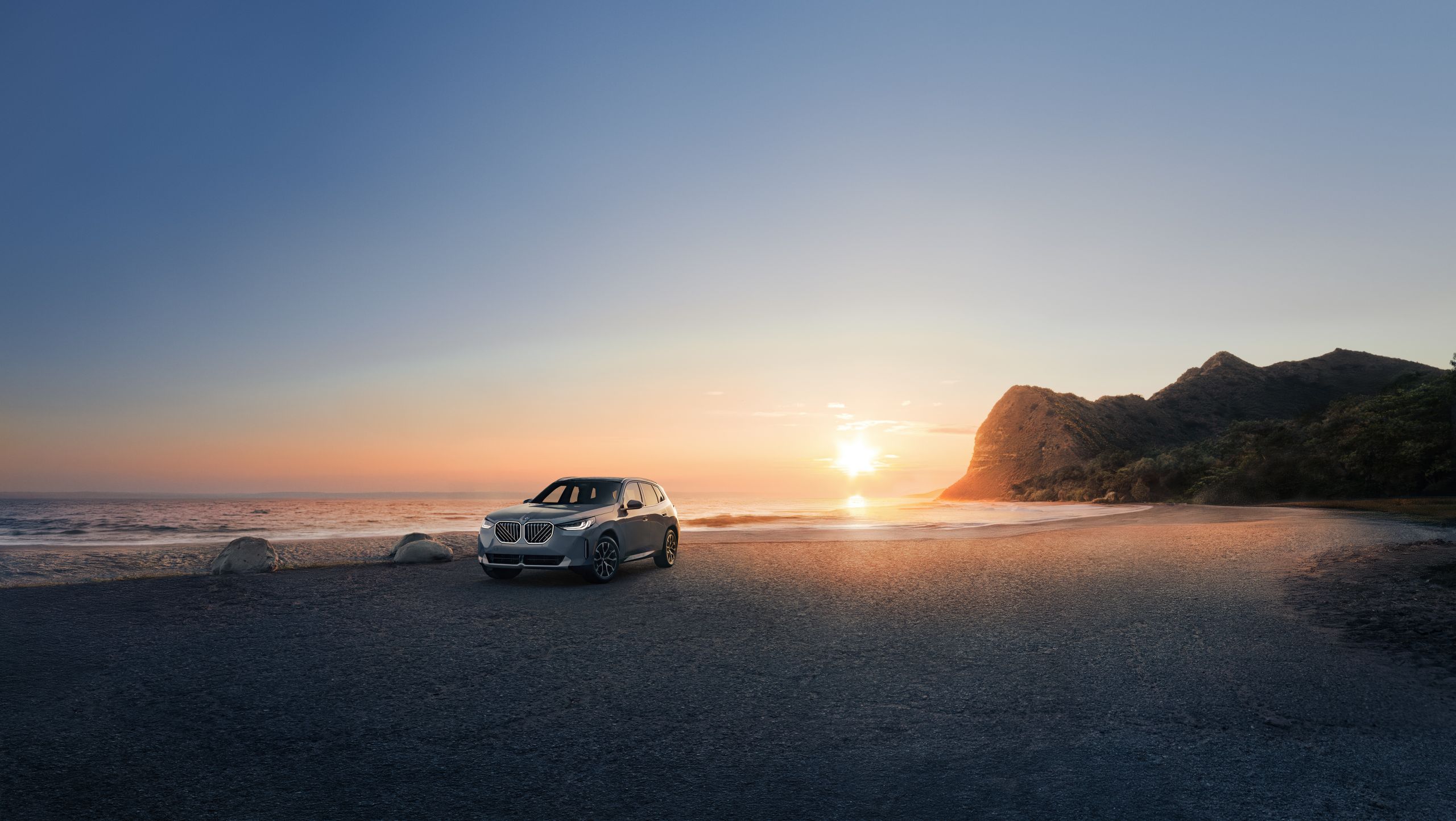 A 2025 BMW X3 30 xDrive SUV parked at the beach