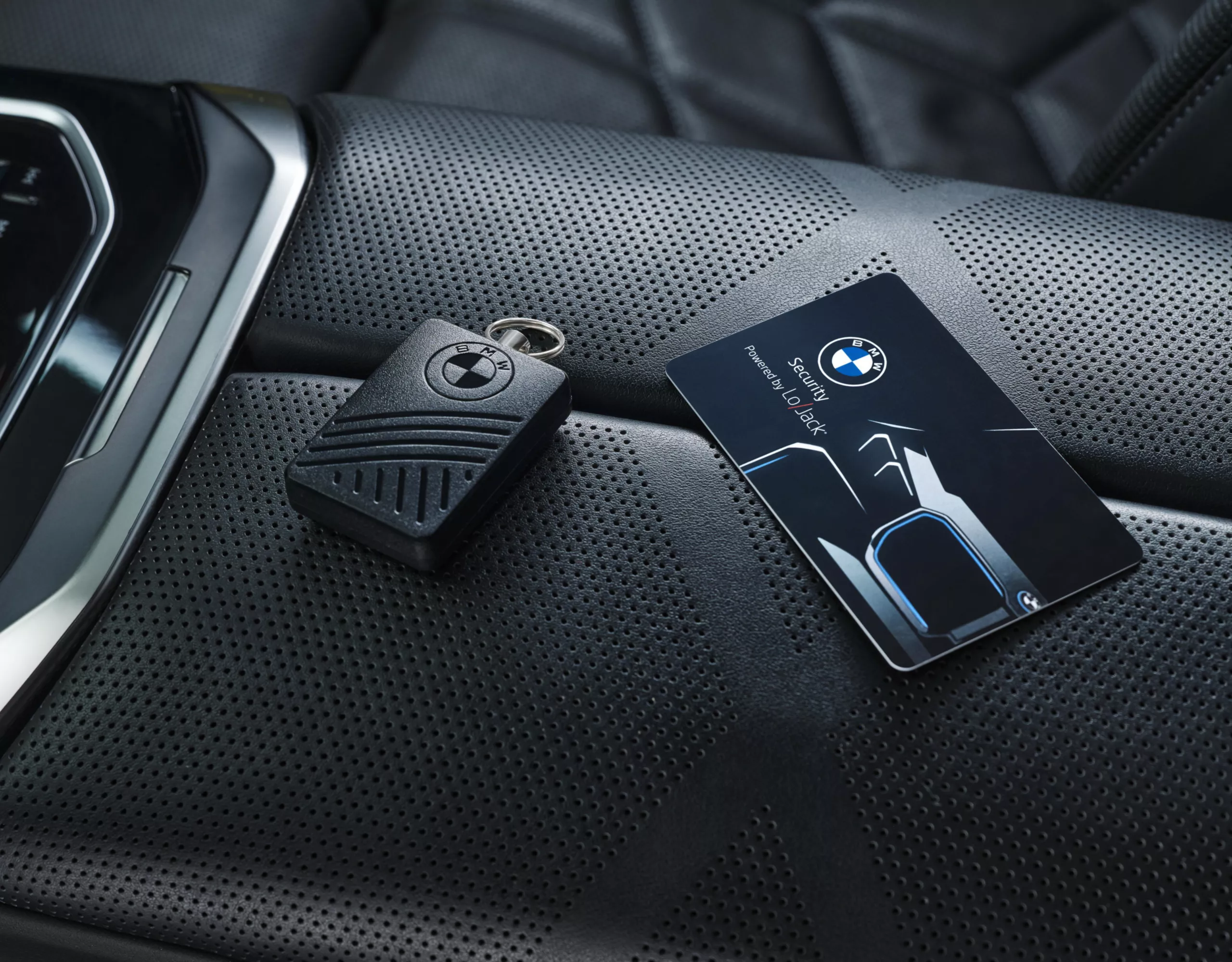 BMW with two bicycles mounted on the rear bike rack is parked on the street