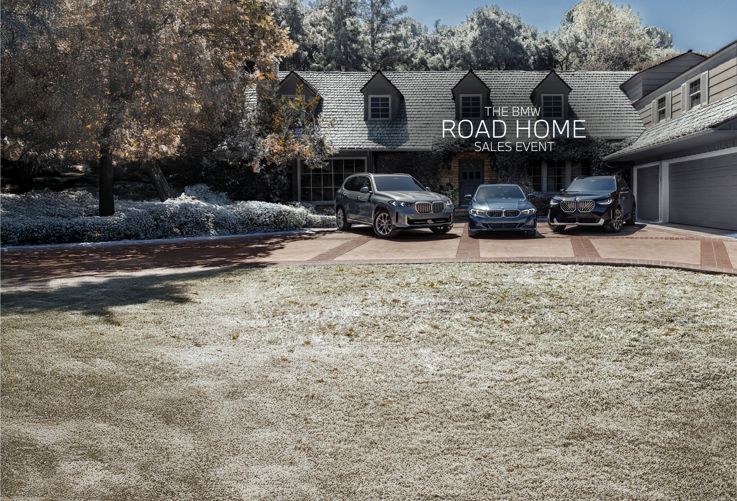 A BMW X5 xDrive40i, 330i xDrive and X3 30 xDrive parked in front of a snow-covered home