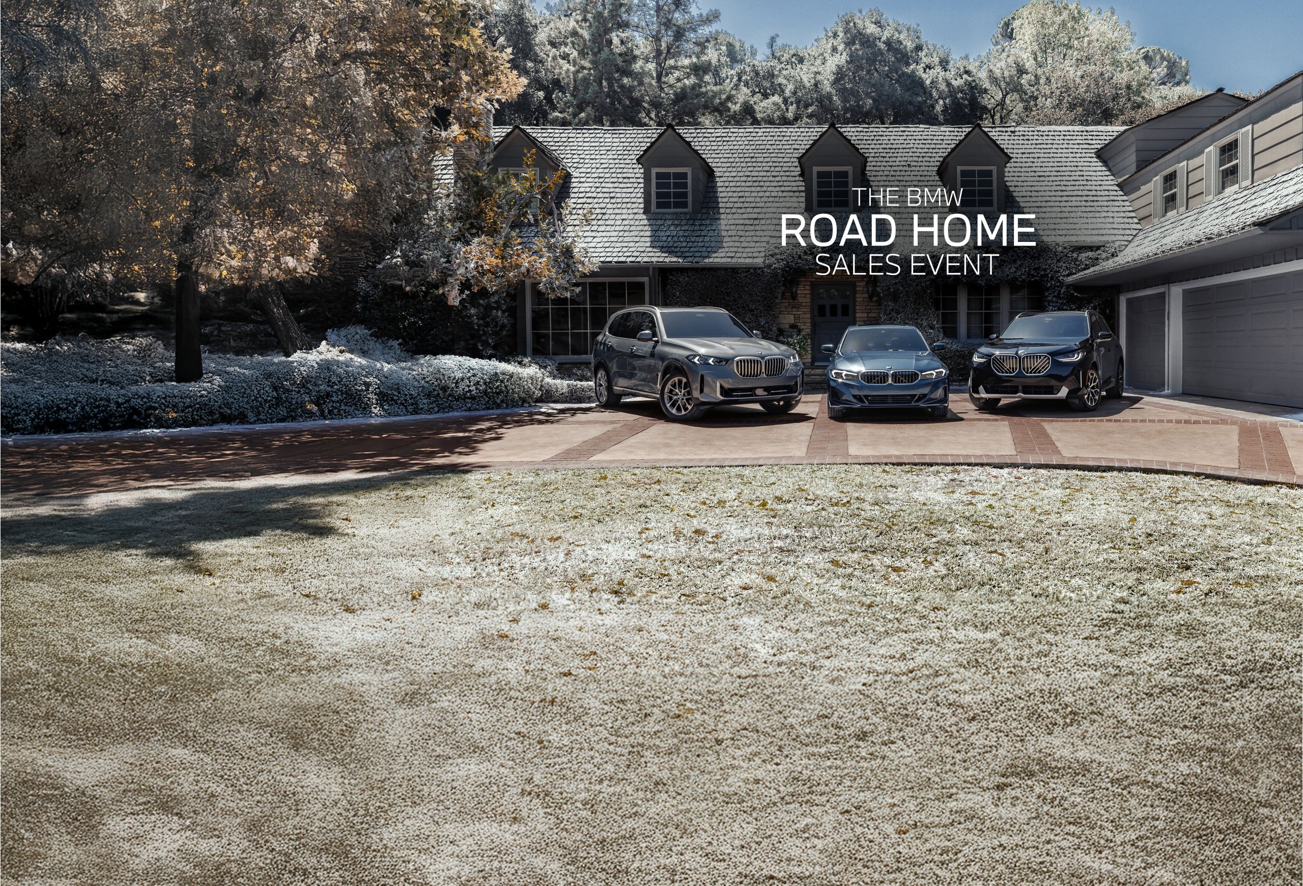 A BMW X5 xDrive40i, 330i xDrive and X3 30 xDrive parked in front of a snow-covered home