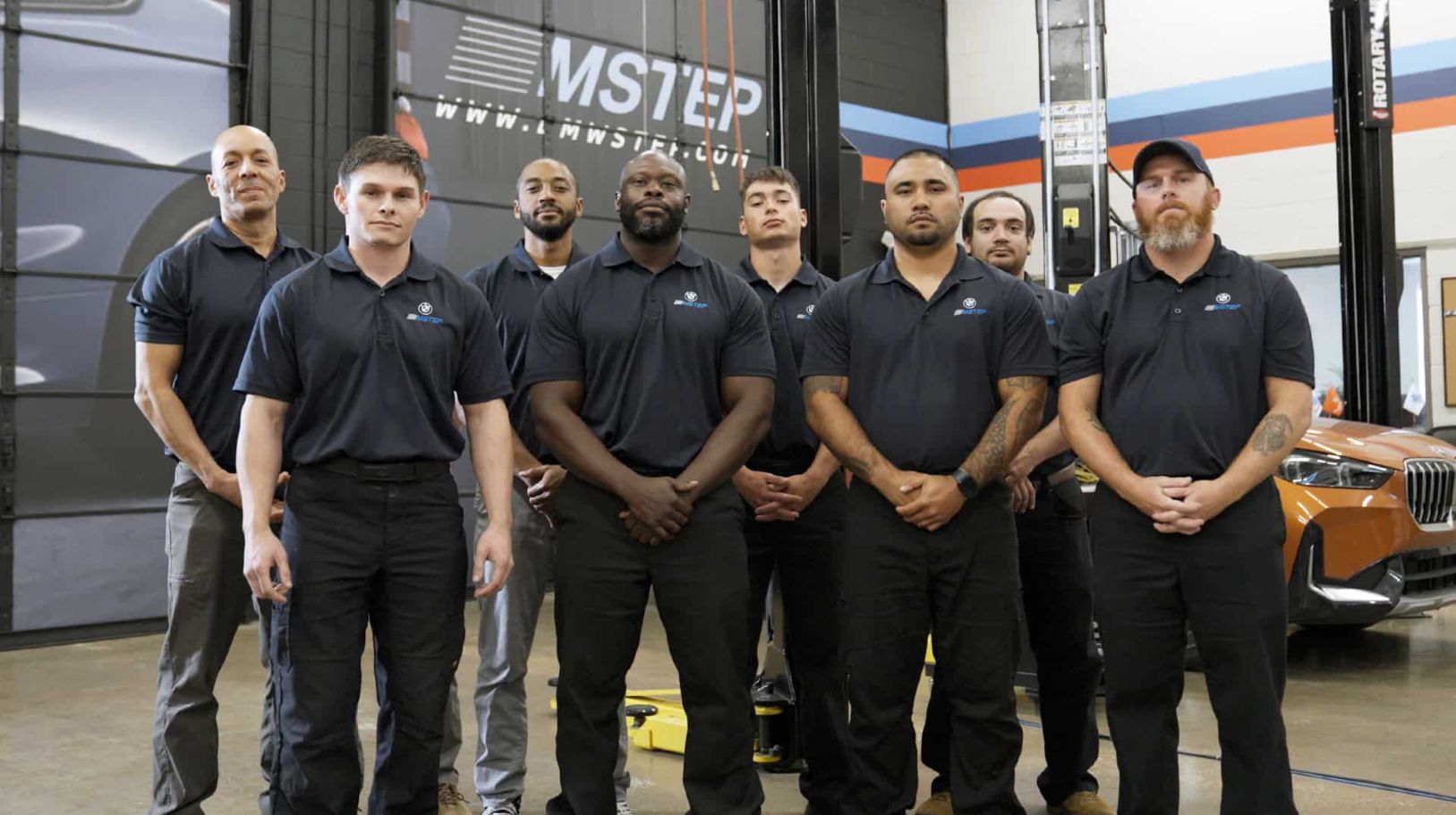A group of MSTEP trainees posing inside of an MSTEP training facility