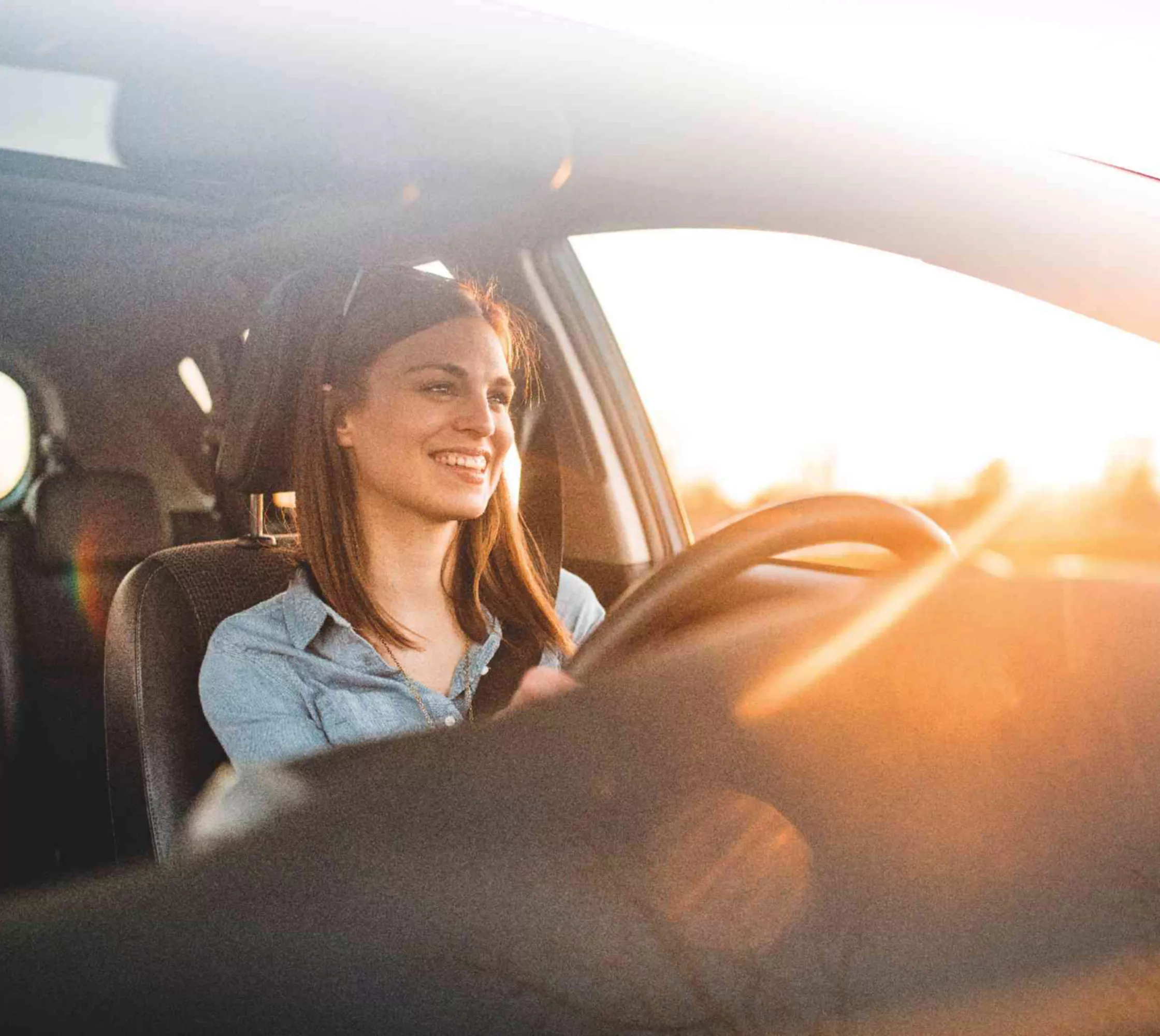 BMW Financial Services BMW three-quarter front view in front of mountain landscape with woman and man