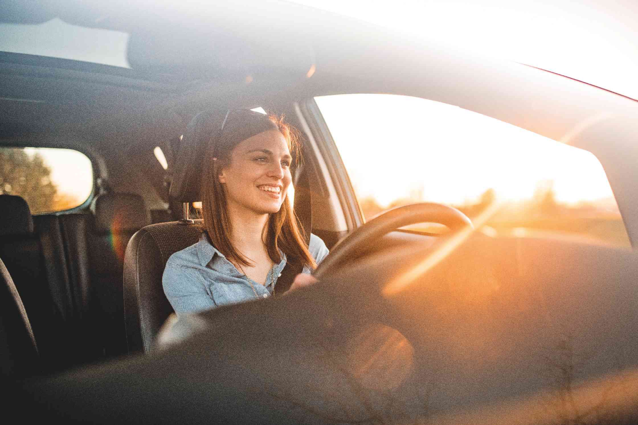 BMW three-quarter front view in front of mountain landscape with woman and man