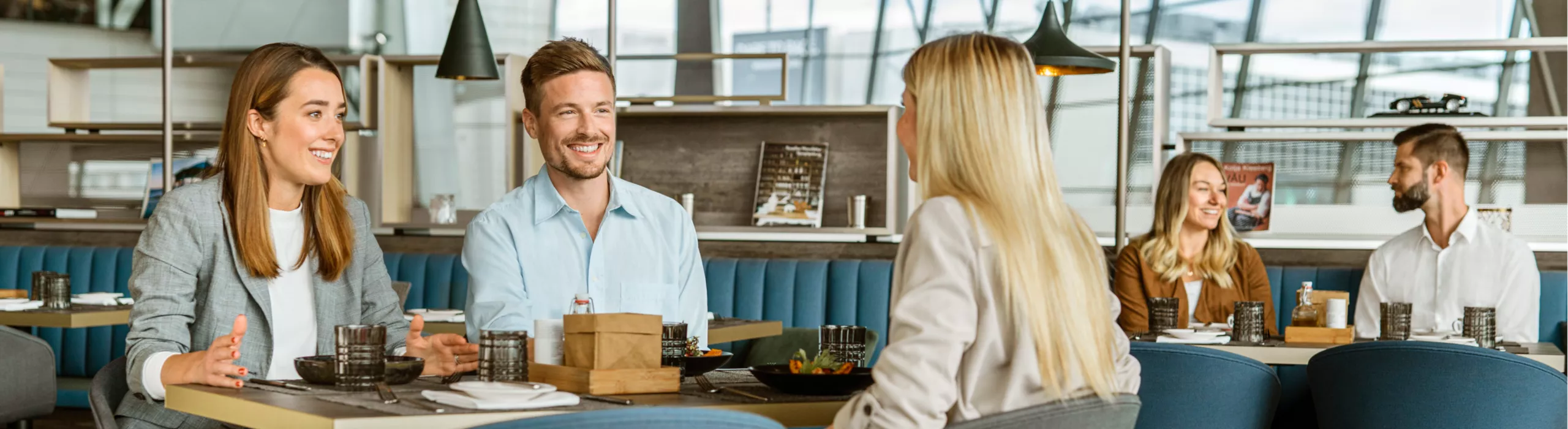 laughing people enjoy dining together