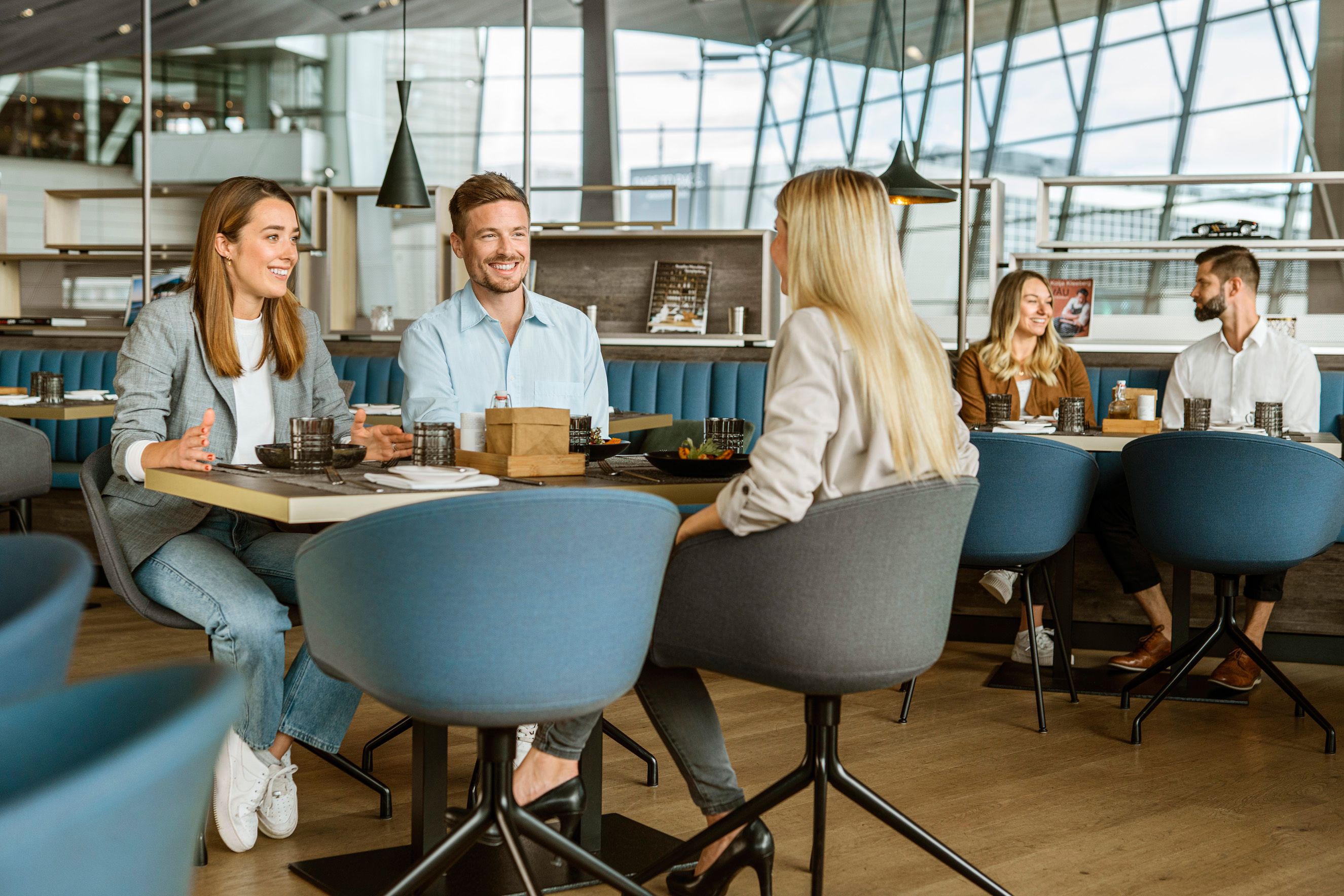 laughing people enjoy dining together