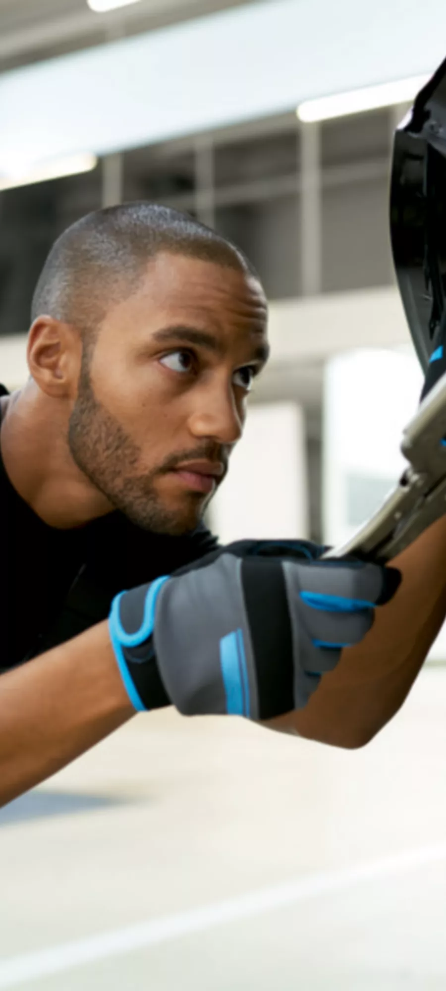 Person sitting in a BMW operating the central information display