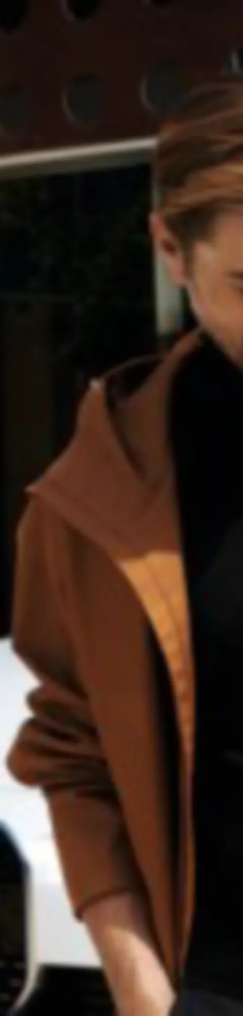 BMW Financial Services man sitting in BMW and woman with smartphone