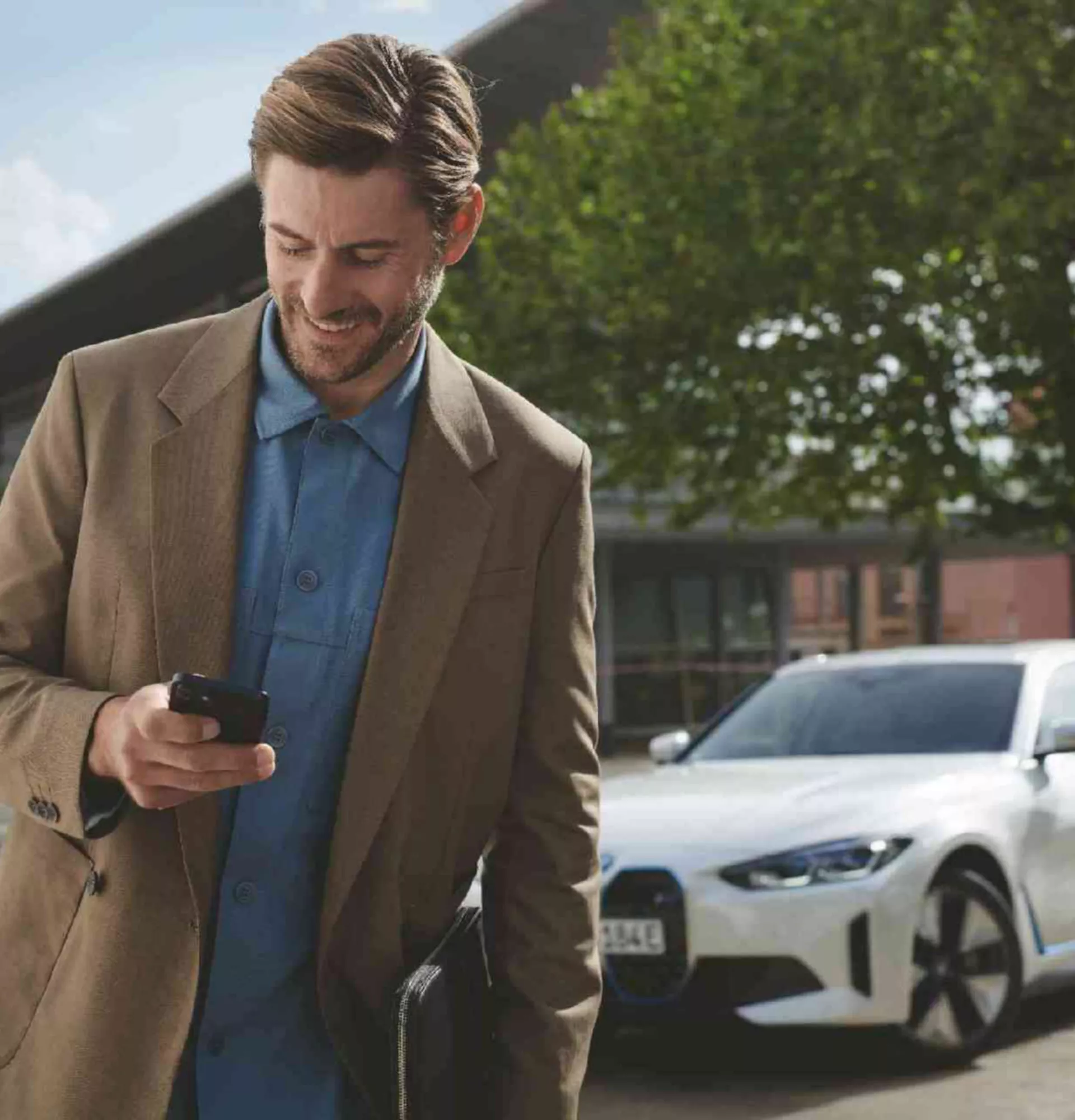  BMW Financial Services man with BMW i3 on charging station