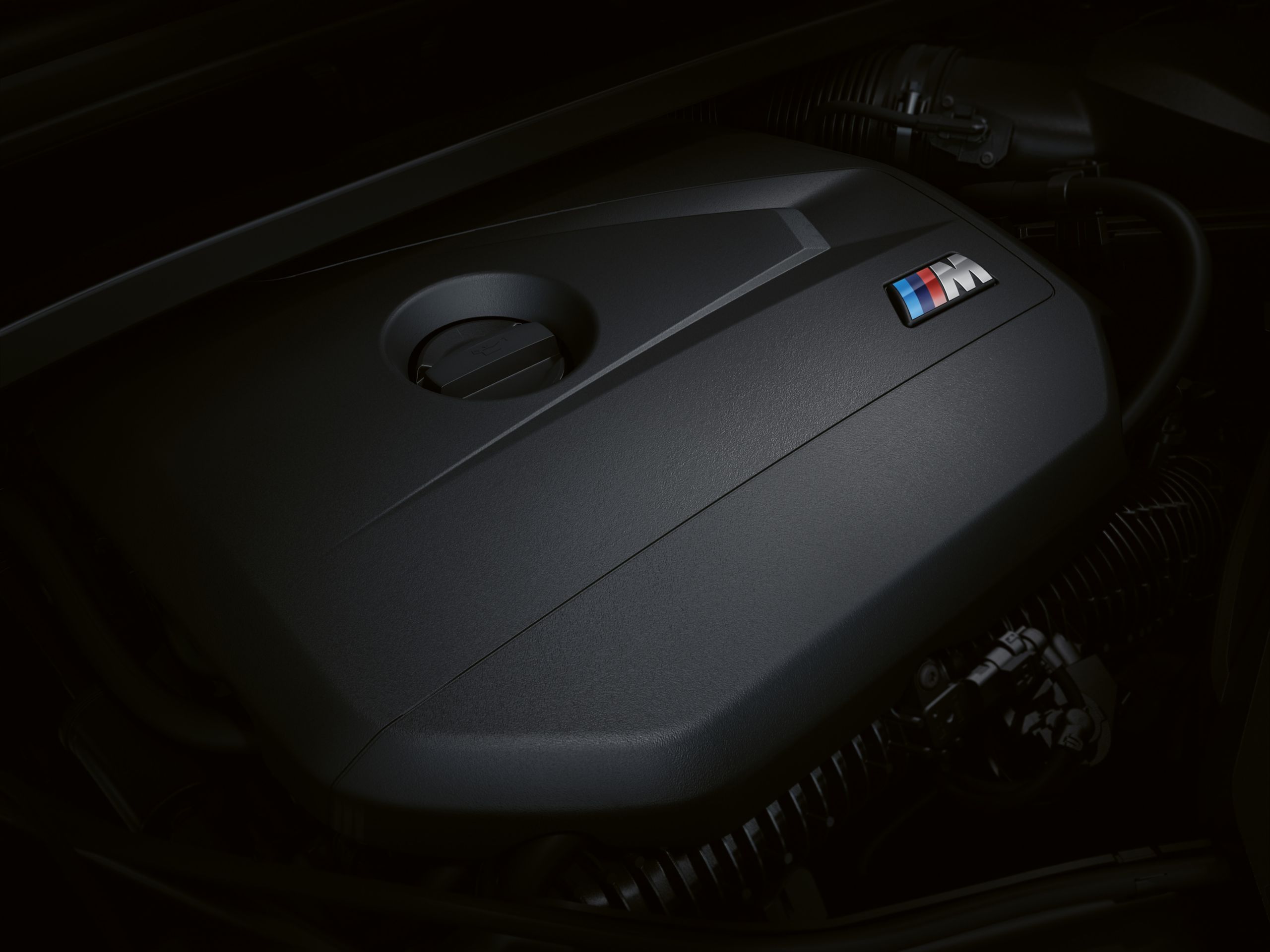 Close up of the BMW X1 M35i's M TwinPower Turbo inline 4-cylinder engine.