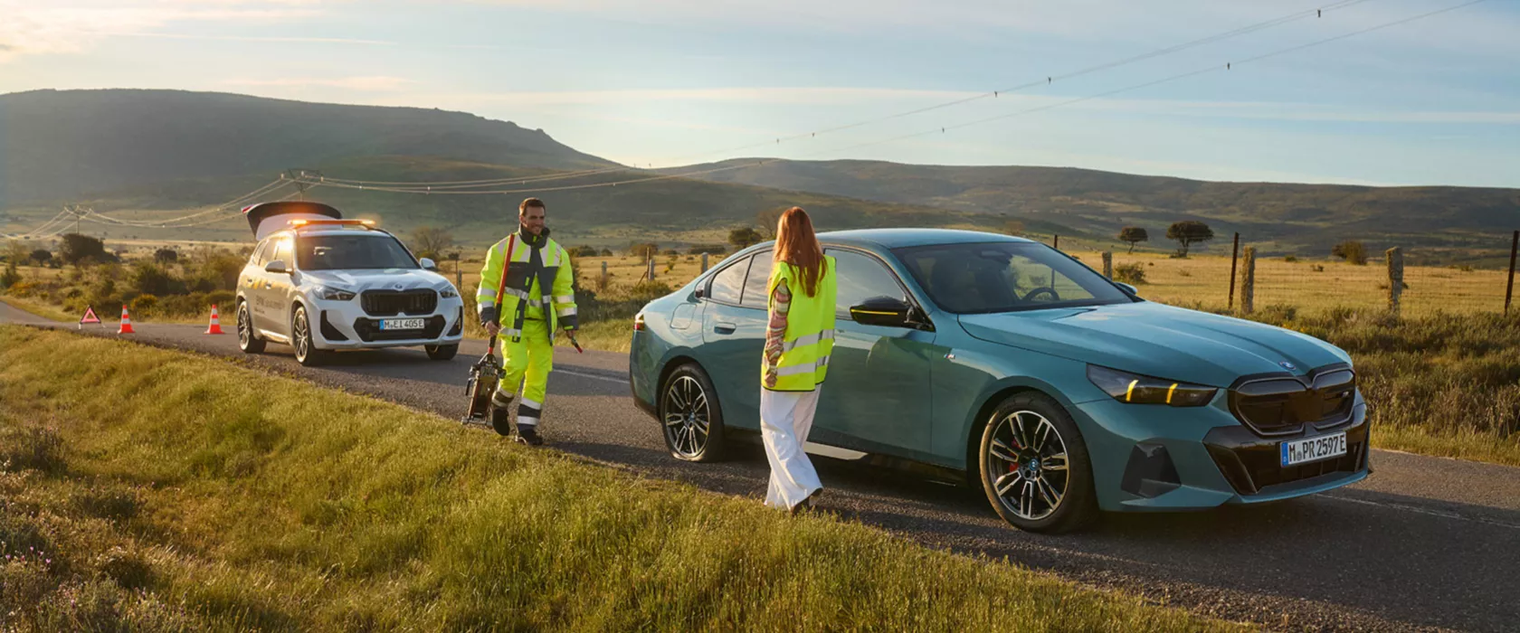 Roadside assistance helping broken car on the road.