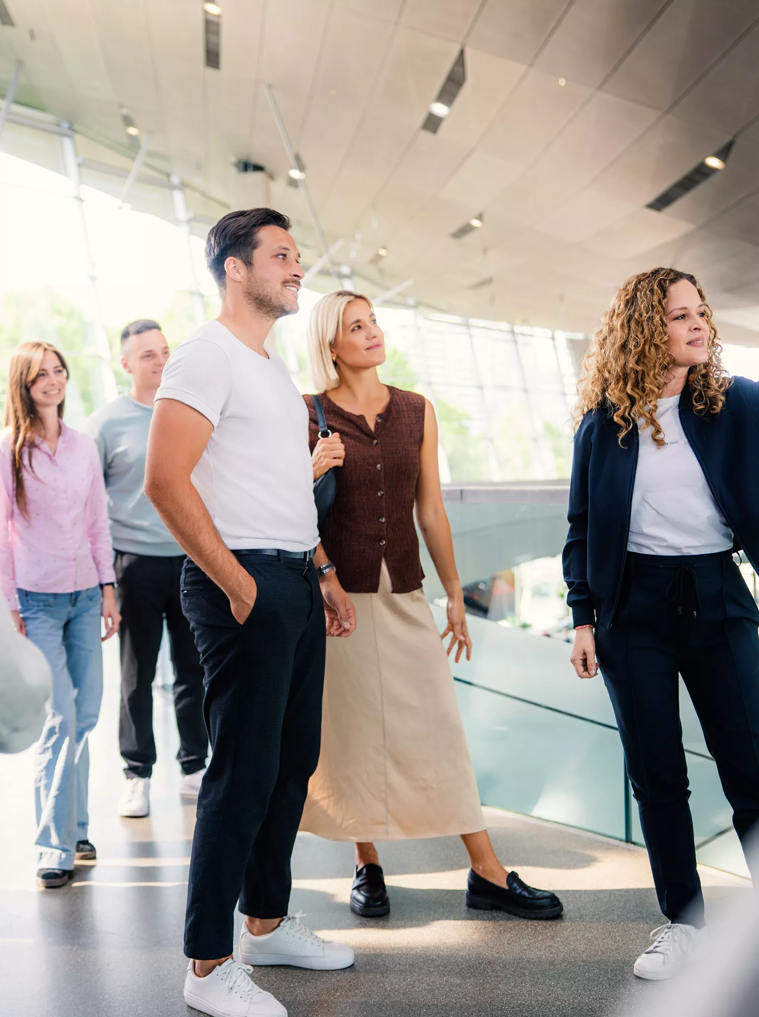 Guided visitor group during a tour through BMW Welt.