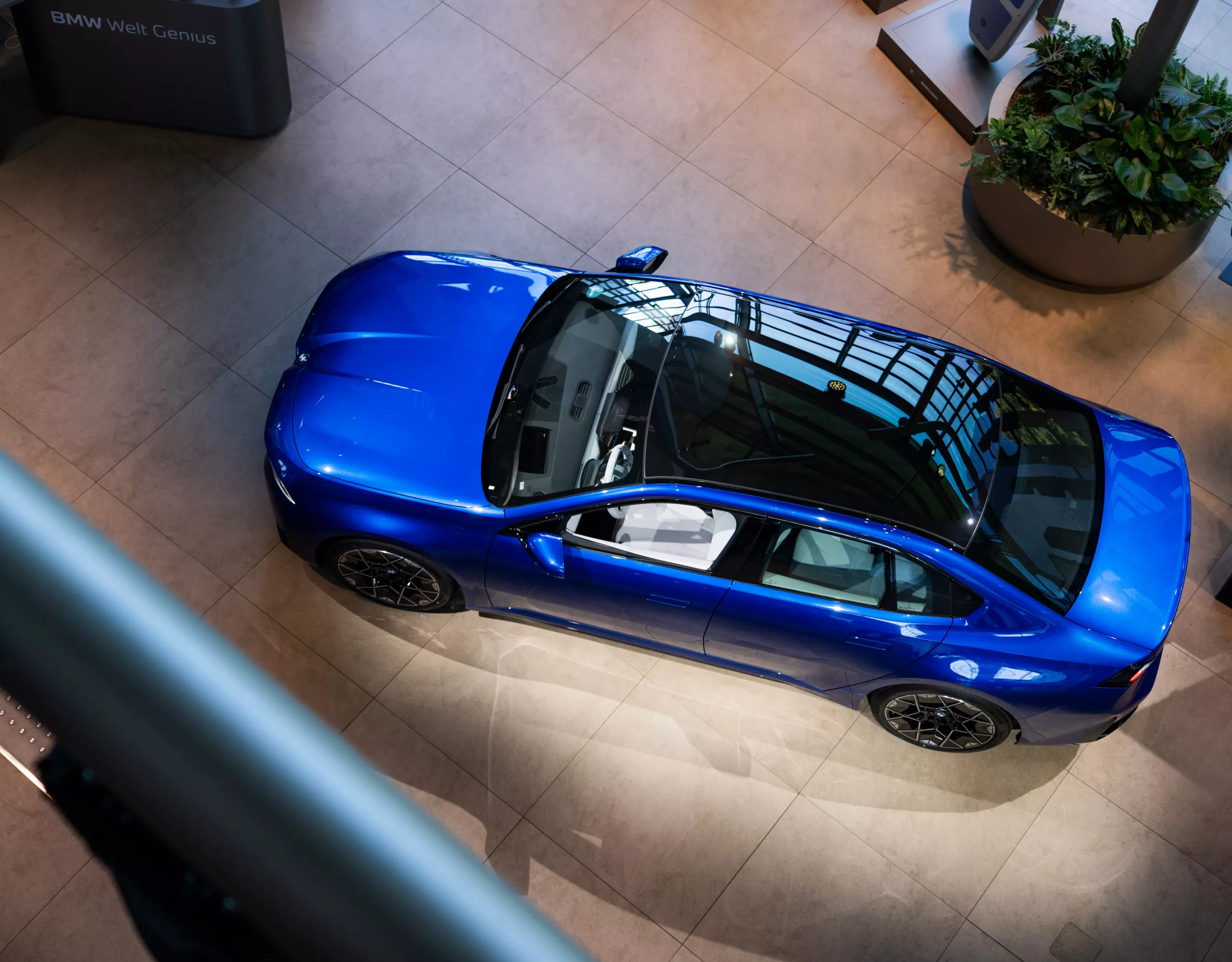 Bird's-eye view of a blue BMW i3 at BMW Welt.