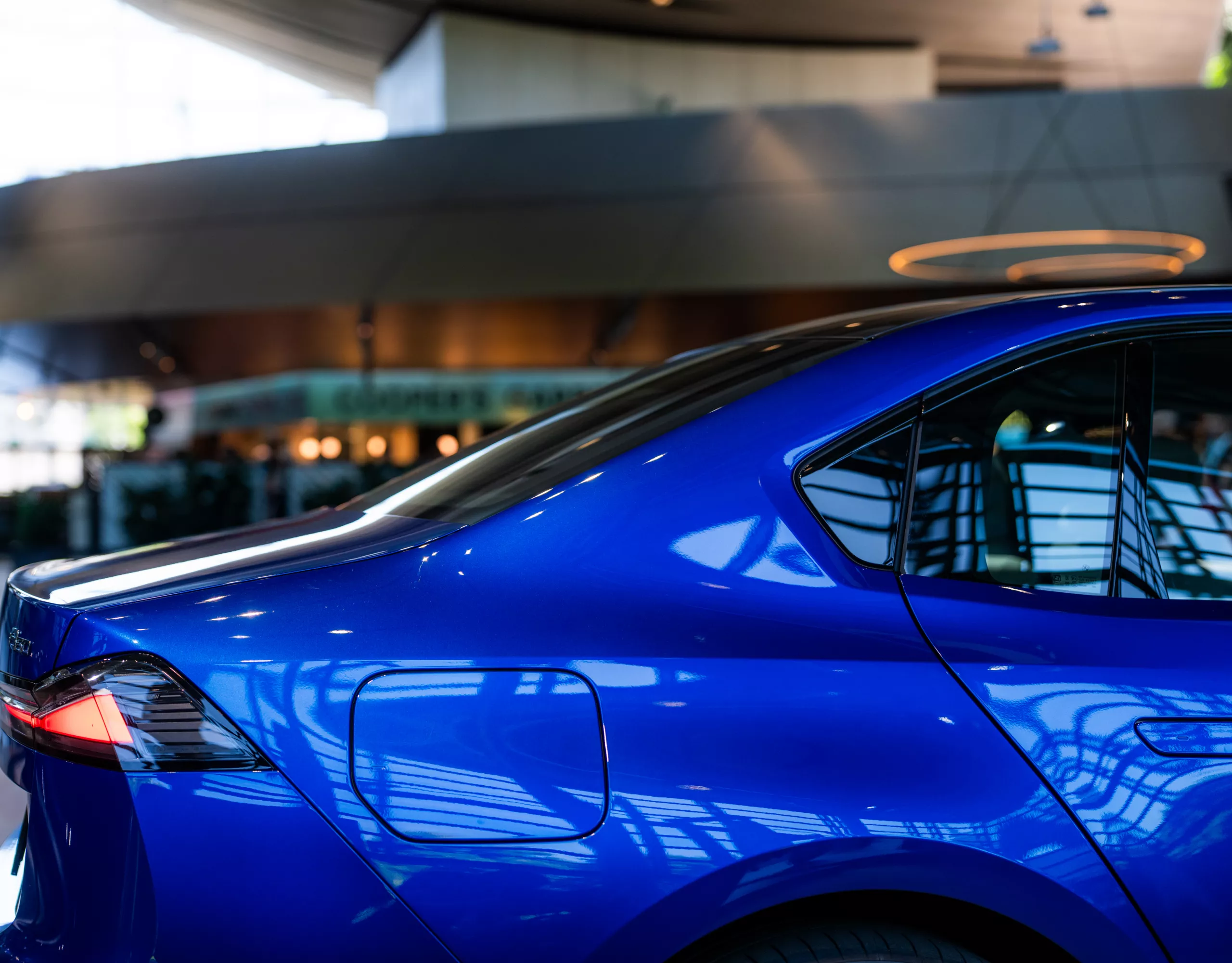 Detailed side view of a blue BMW i3 at BMW Welt.