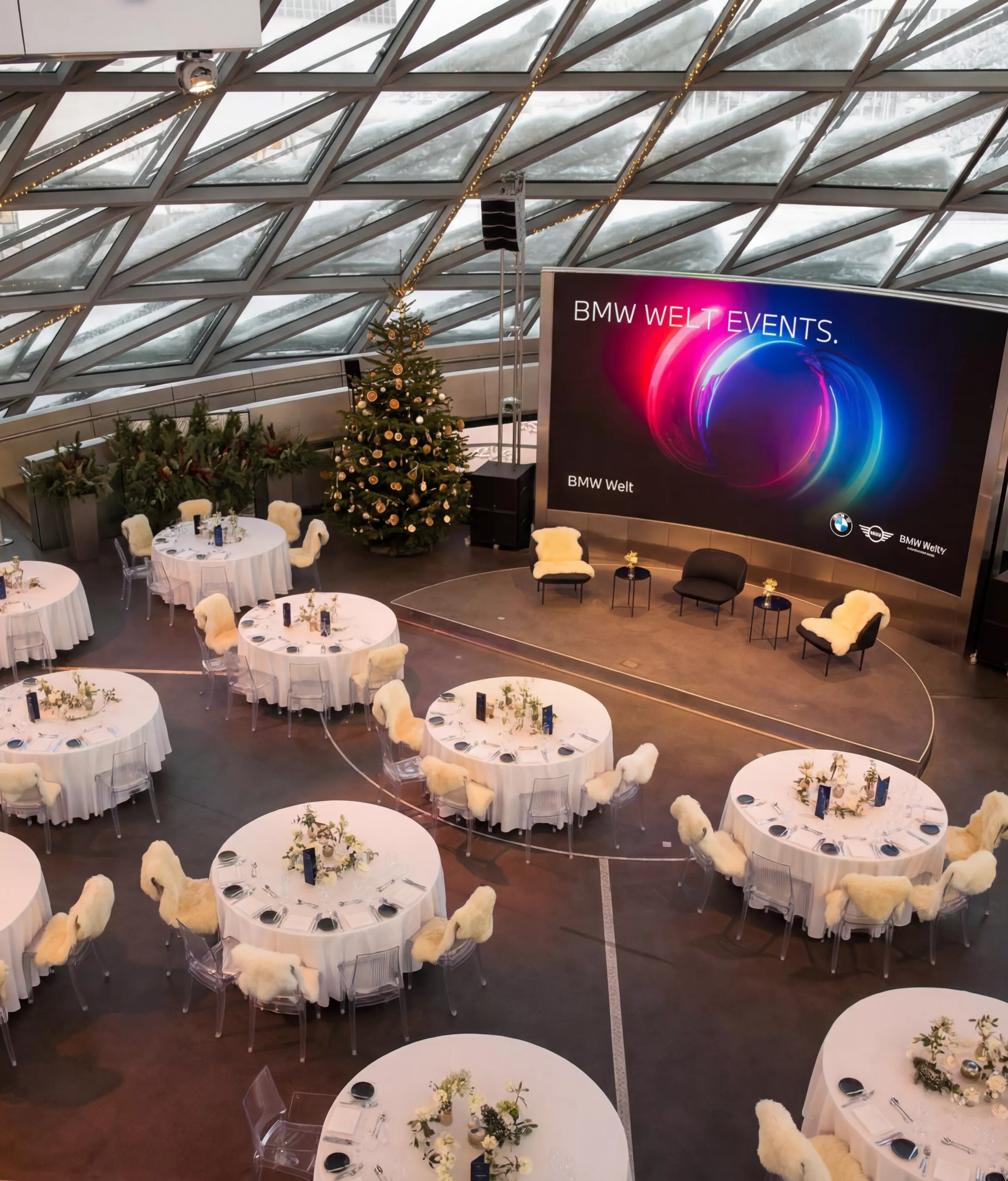 Interior view of the Double Cone at BMW Welt with winter decorations.