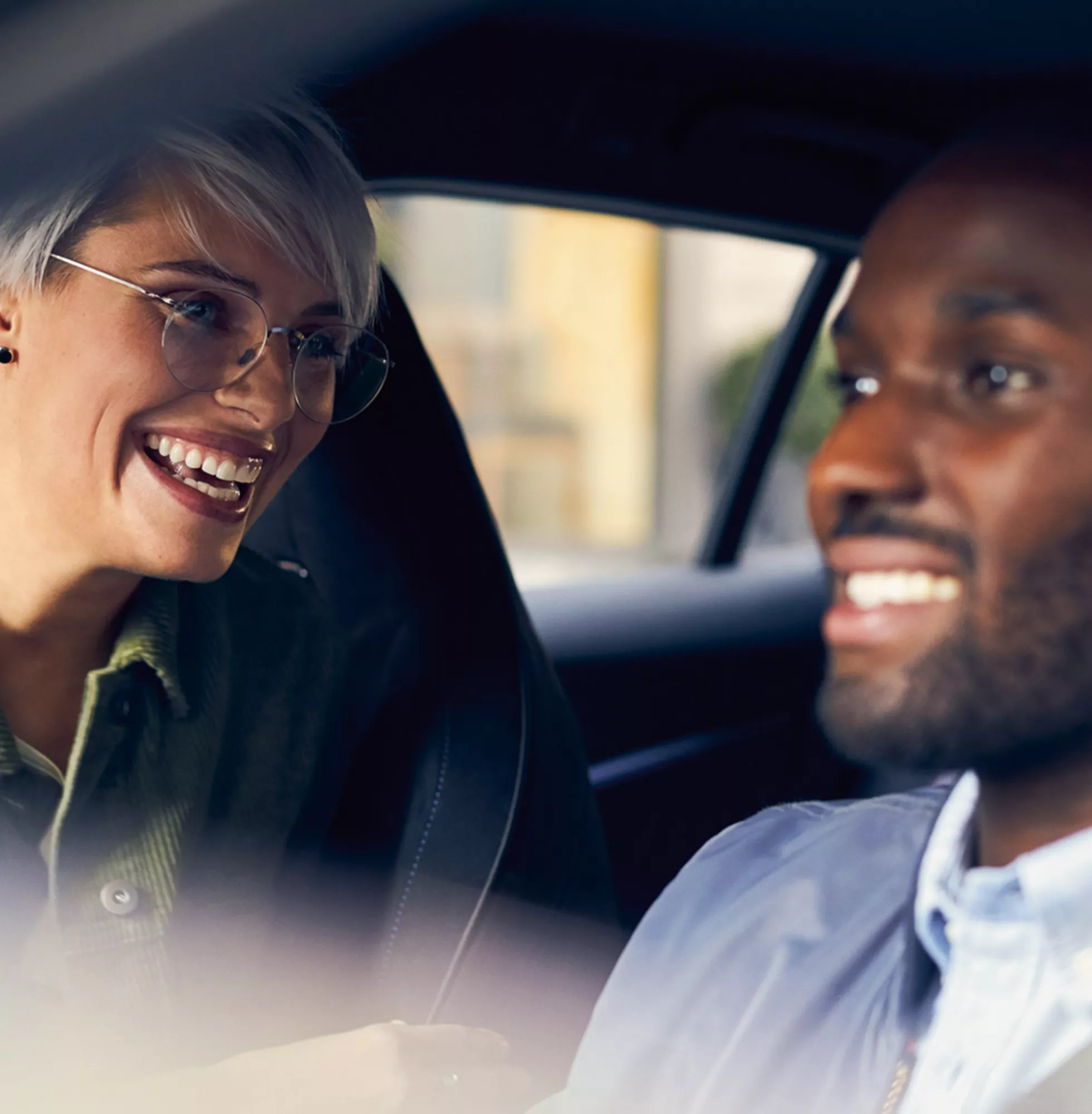 Two people in a car interior setting