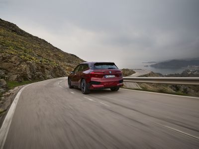 BMW iX red rear view 
