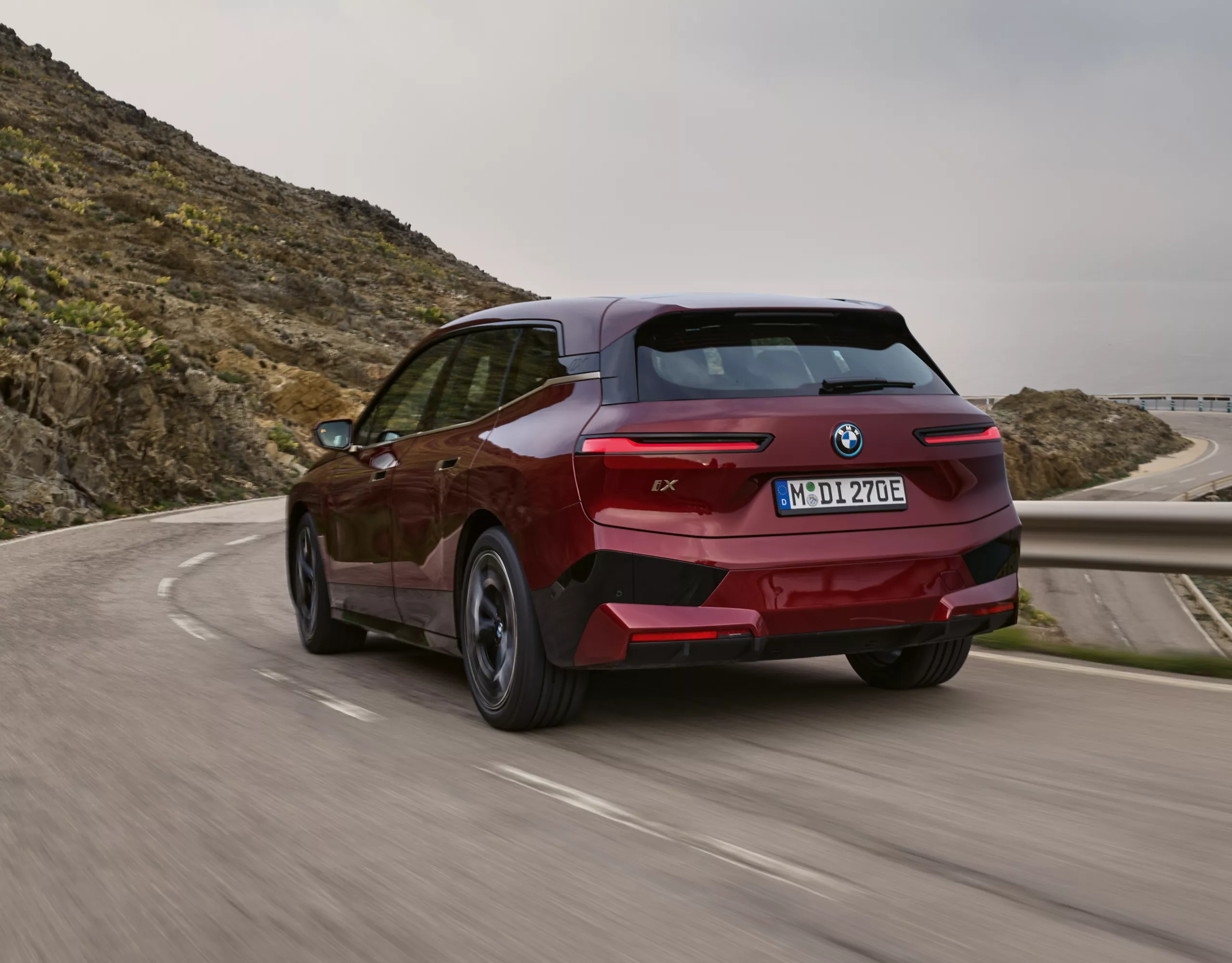 BMW iX red rear view 
