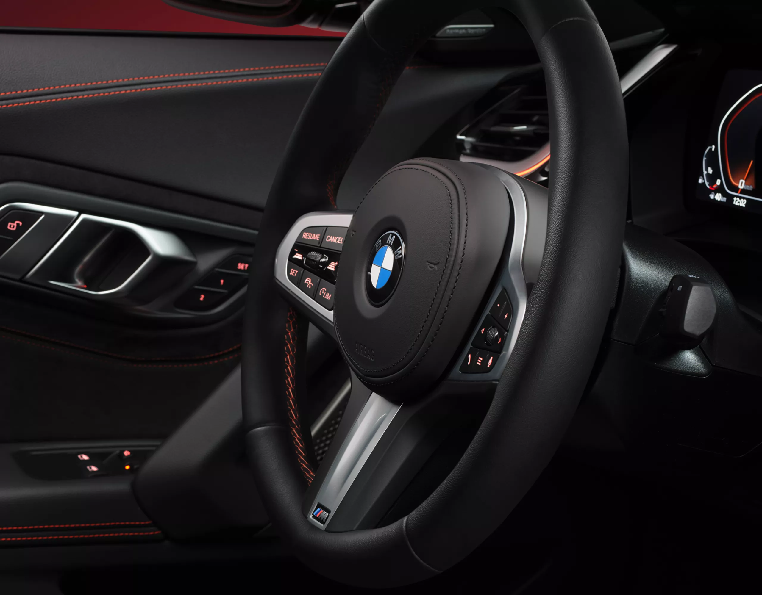 The BMW Z4 cockpit features a sport leather steering wheel, premium materials, and a driver-centric layout designed for pure engagement