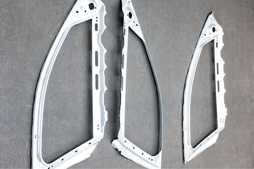 Several pieces of metal framework placed on gray background