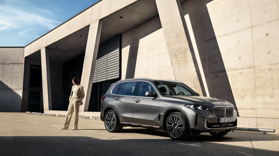 BMW Financial Services BMW Leasing woman puts her feet on the door of a BMW