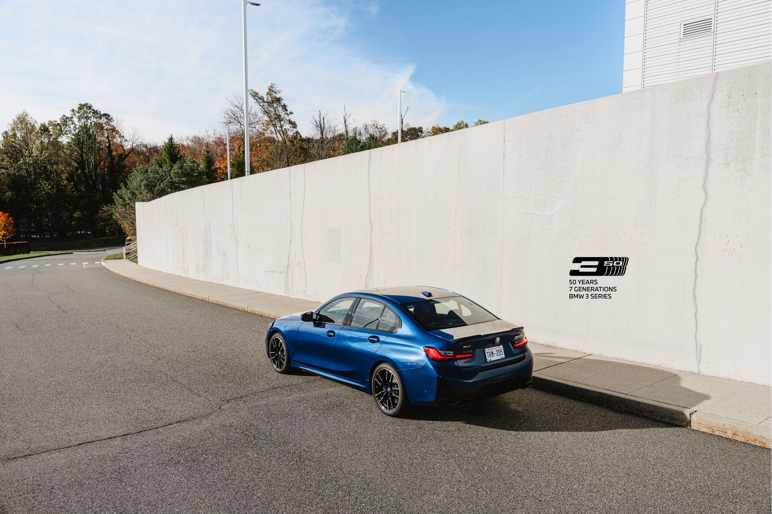 3/4 shot of a BMW M340i xDrive 50 Jahre Edition parked on a racetrack