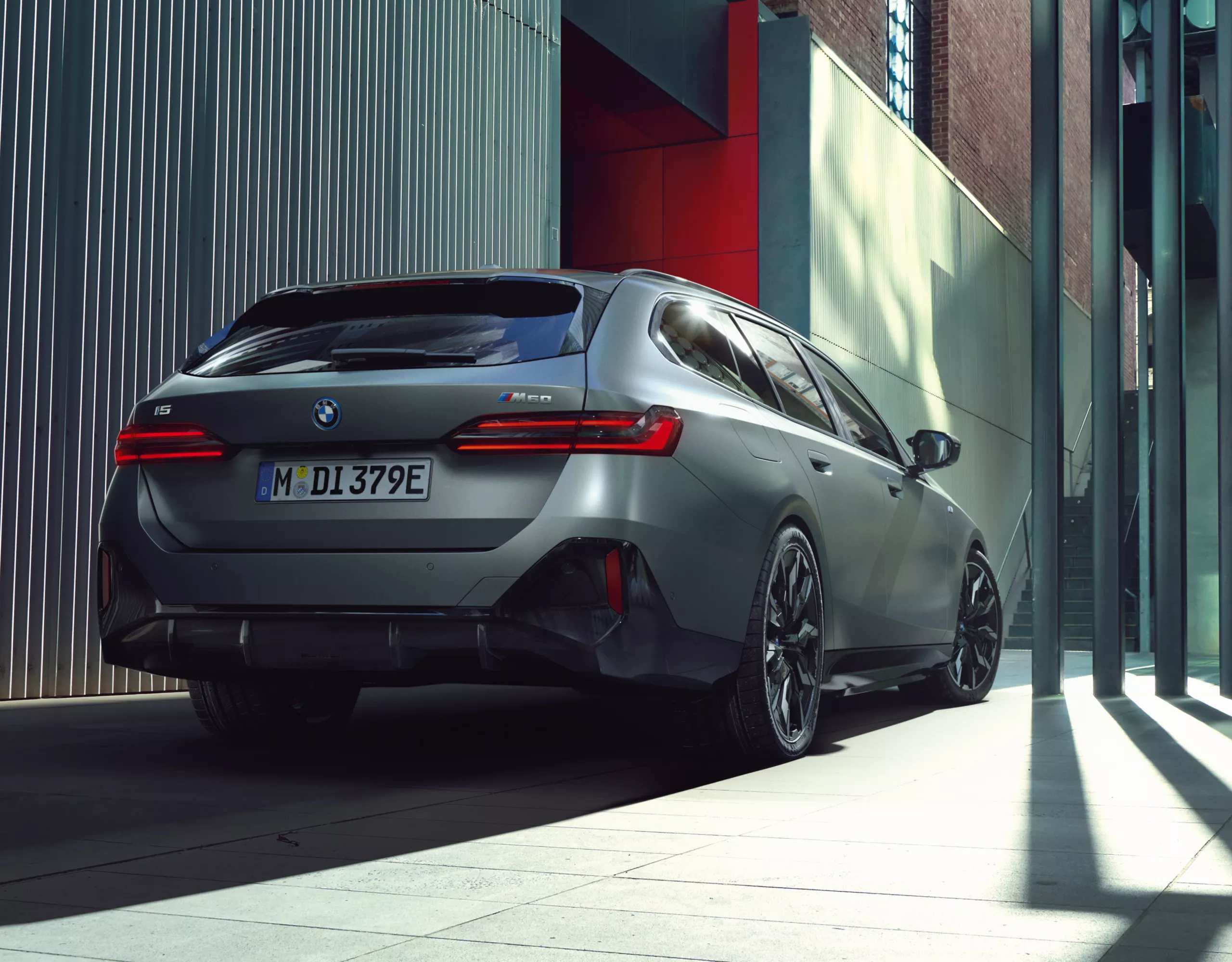 BMW M5 Touring grey rear view 