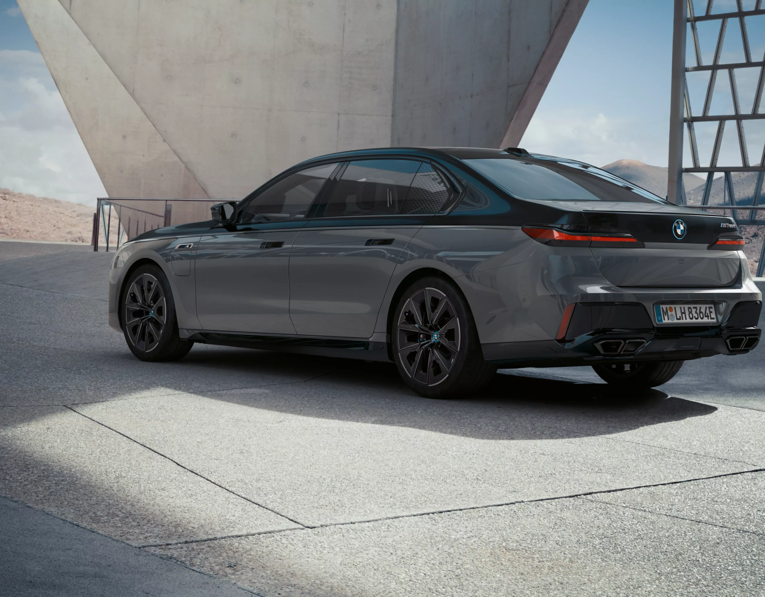 BMW M760e xDrive black rear view