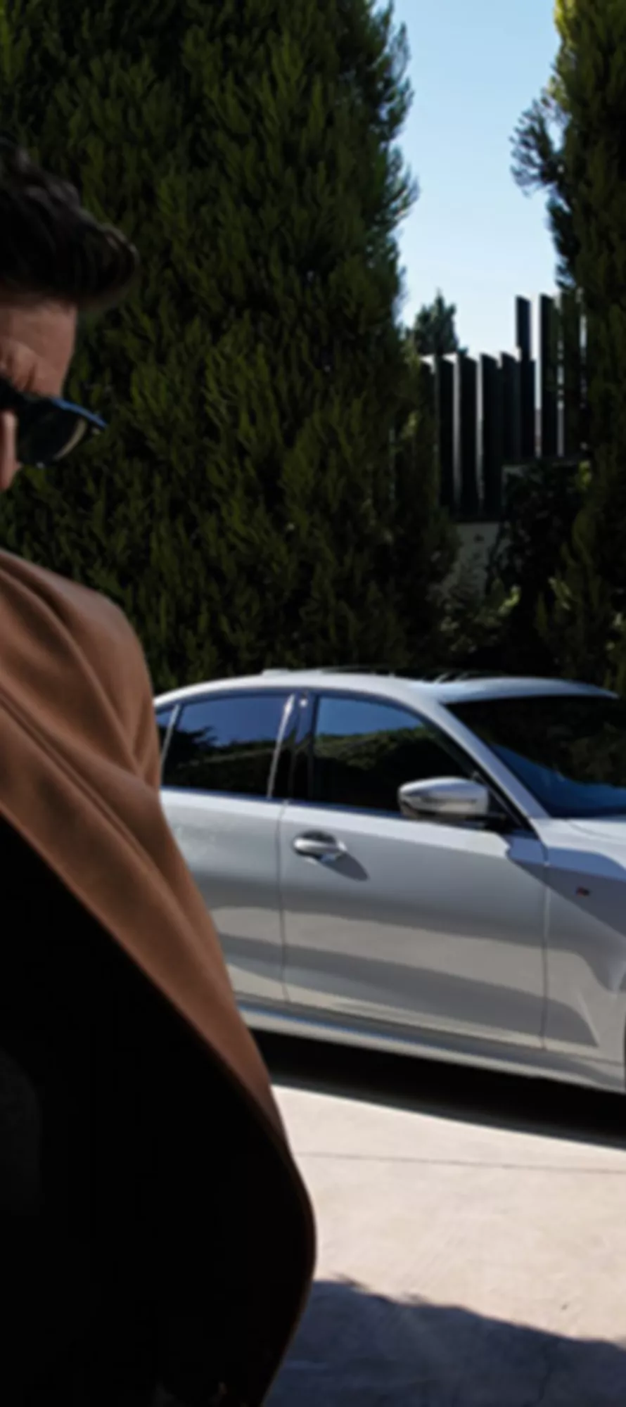 BMW Financial Services man walking away from  a BMW 