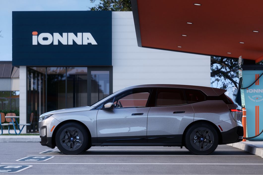 A BMW iX parked at an IONNA charging station