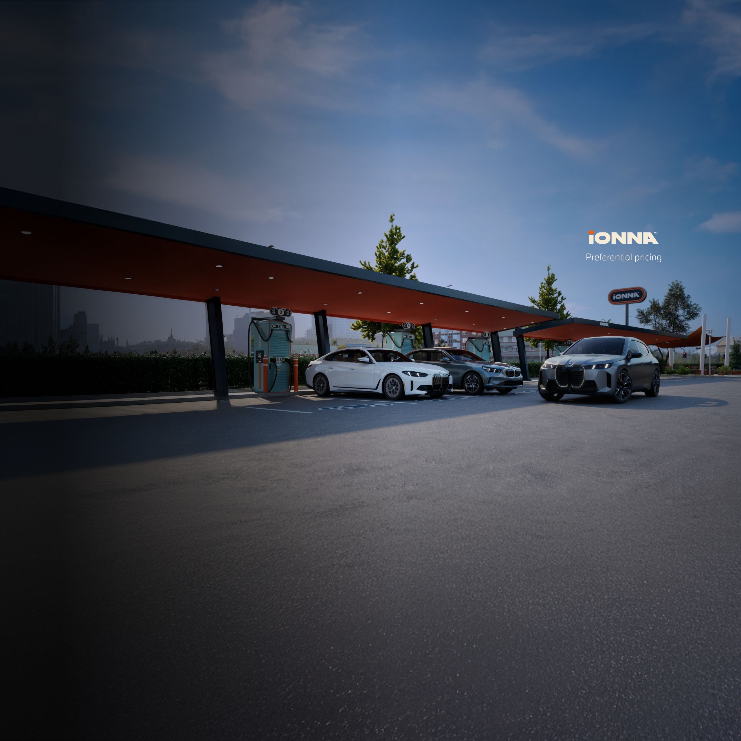 A BMW i4, i5, and iX parked at an IONNA charging station.