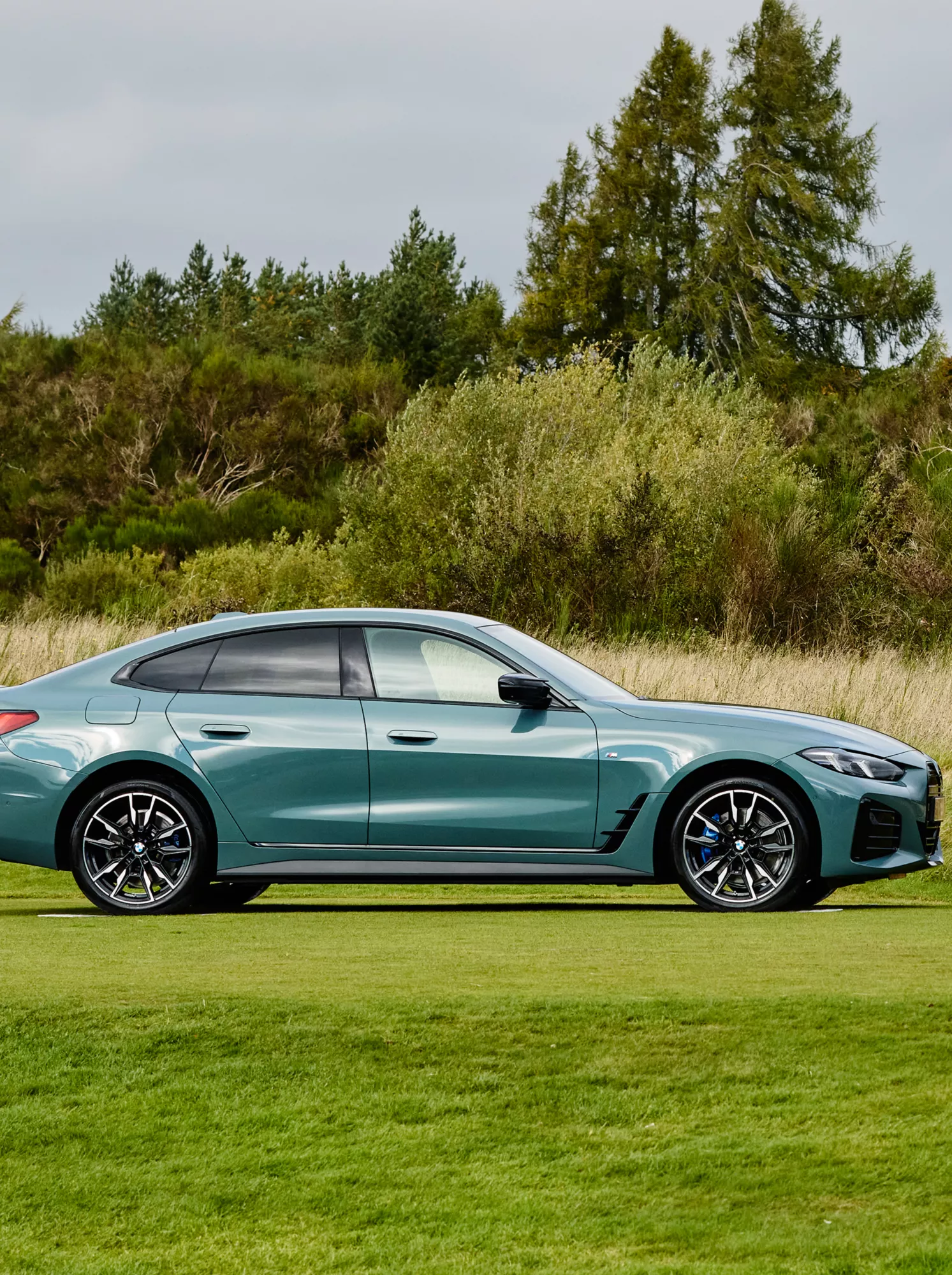 BMW Golf cup with the BMW i4 in background