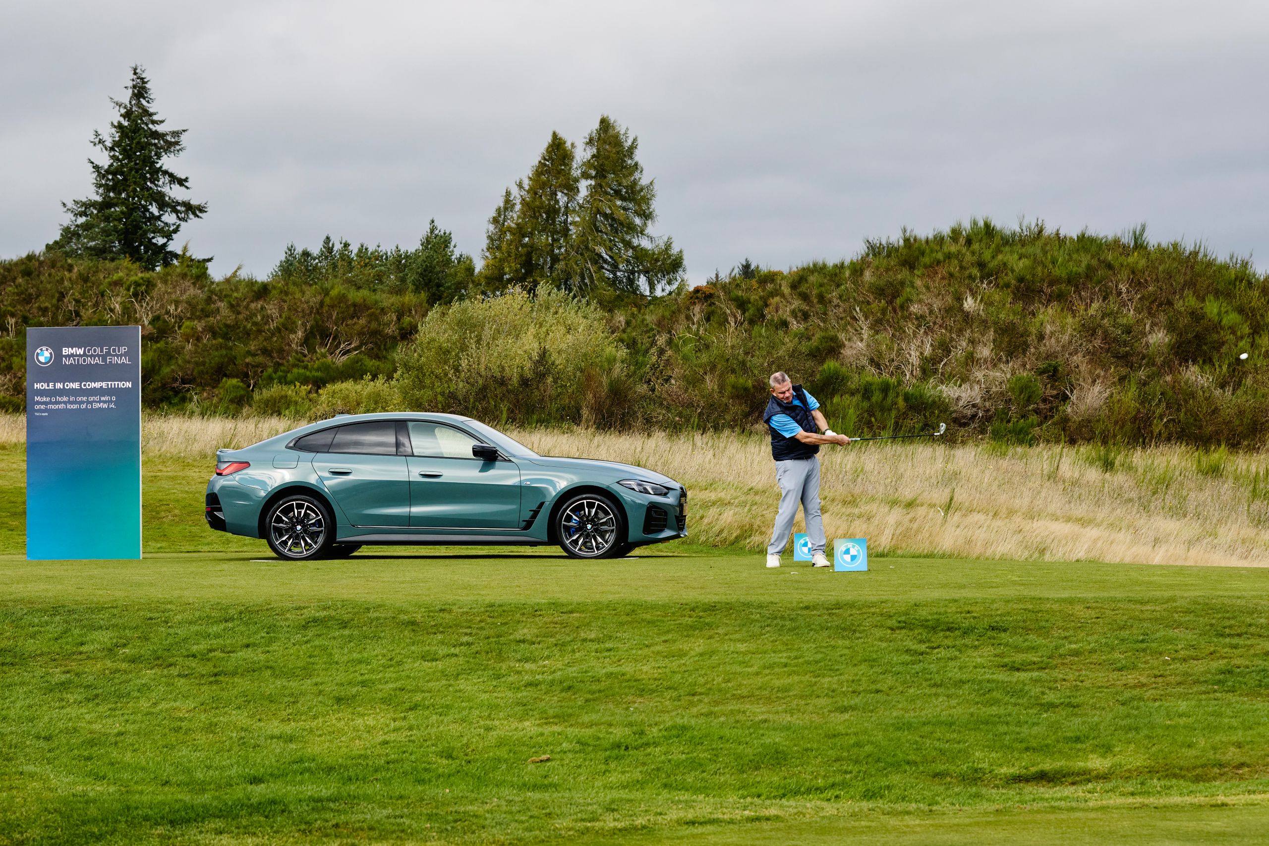 BMW Golf cup with the BMW i4 in background