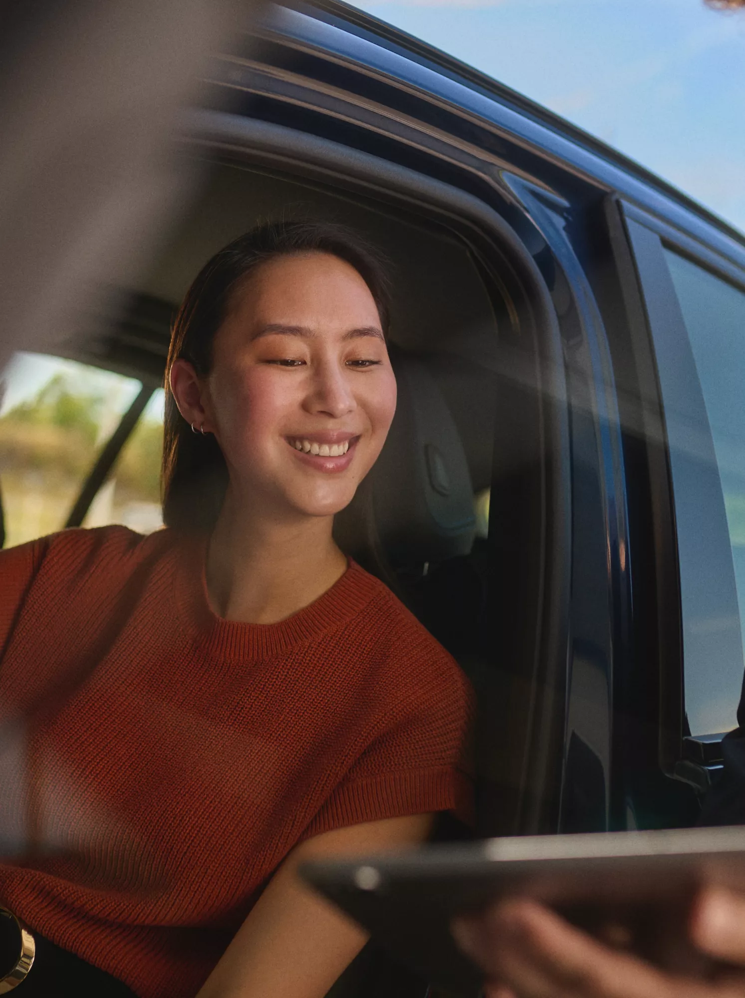 BMW Financial Services BMW Leasing woman puts her feet on the door of a BMW 