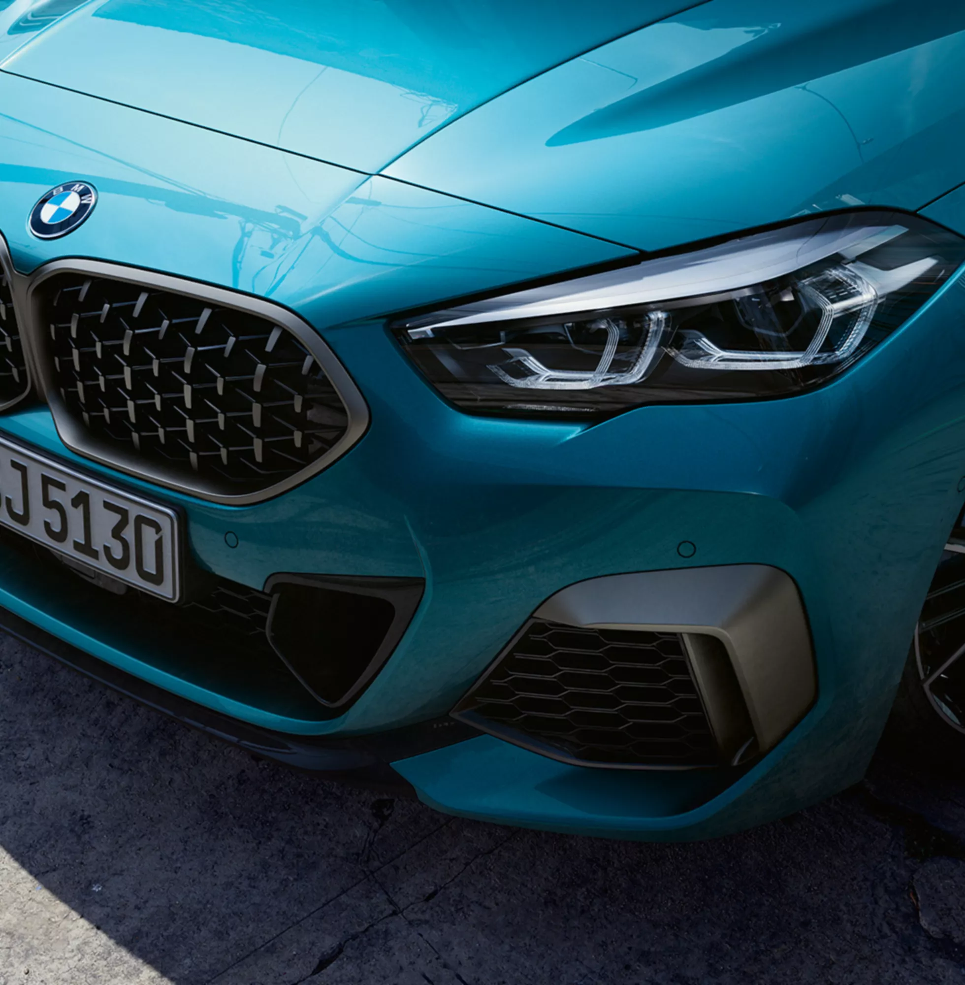 Blue BMW car front view with license plate