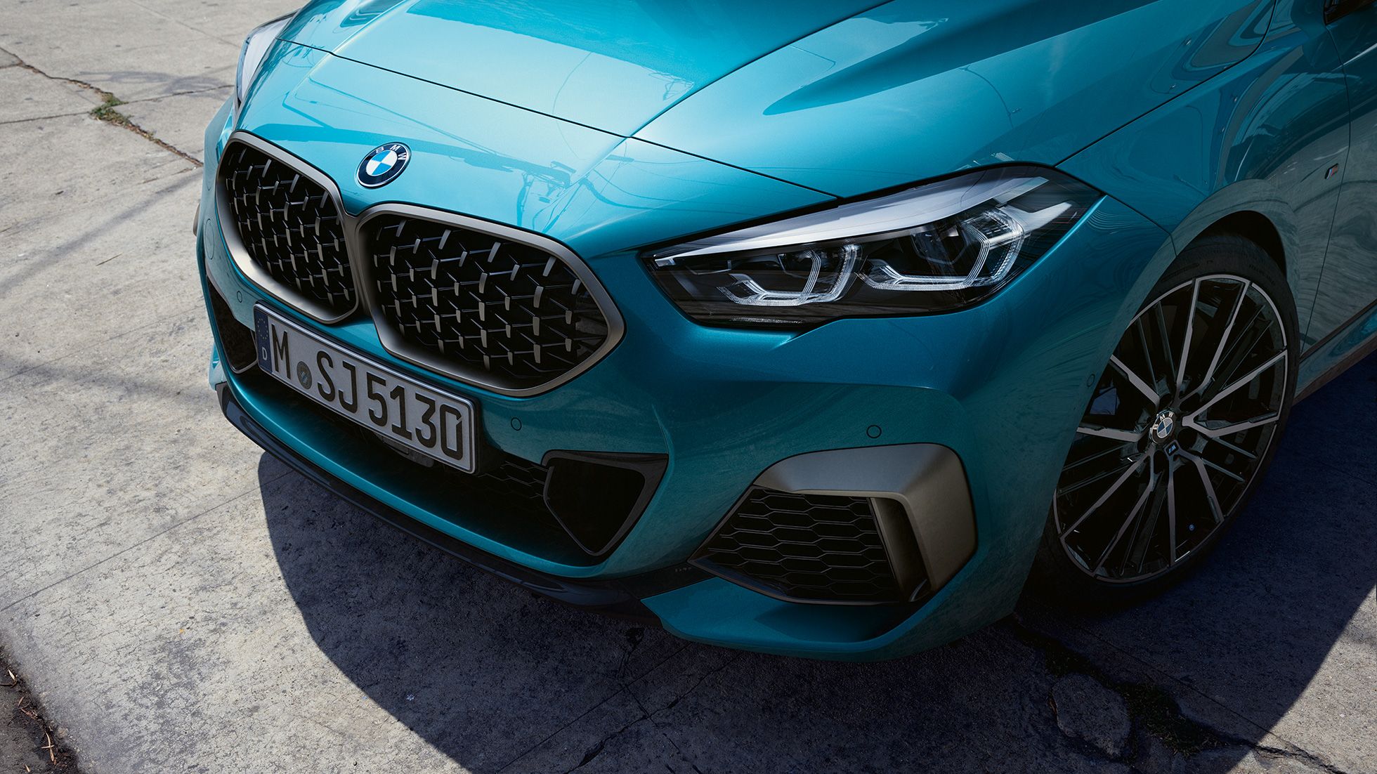 Blue BMW car front view with license plate