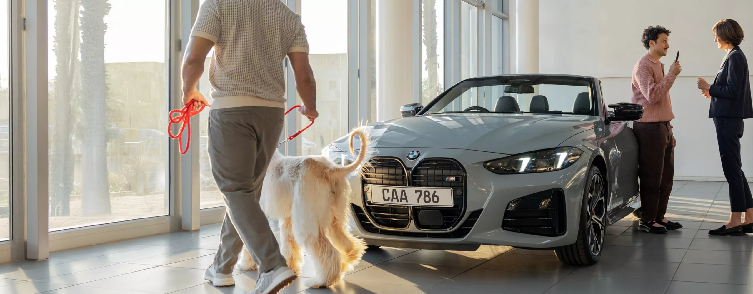 BMW happy customers: young woman and man.