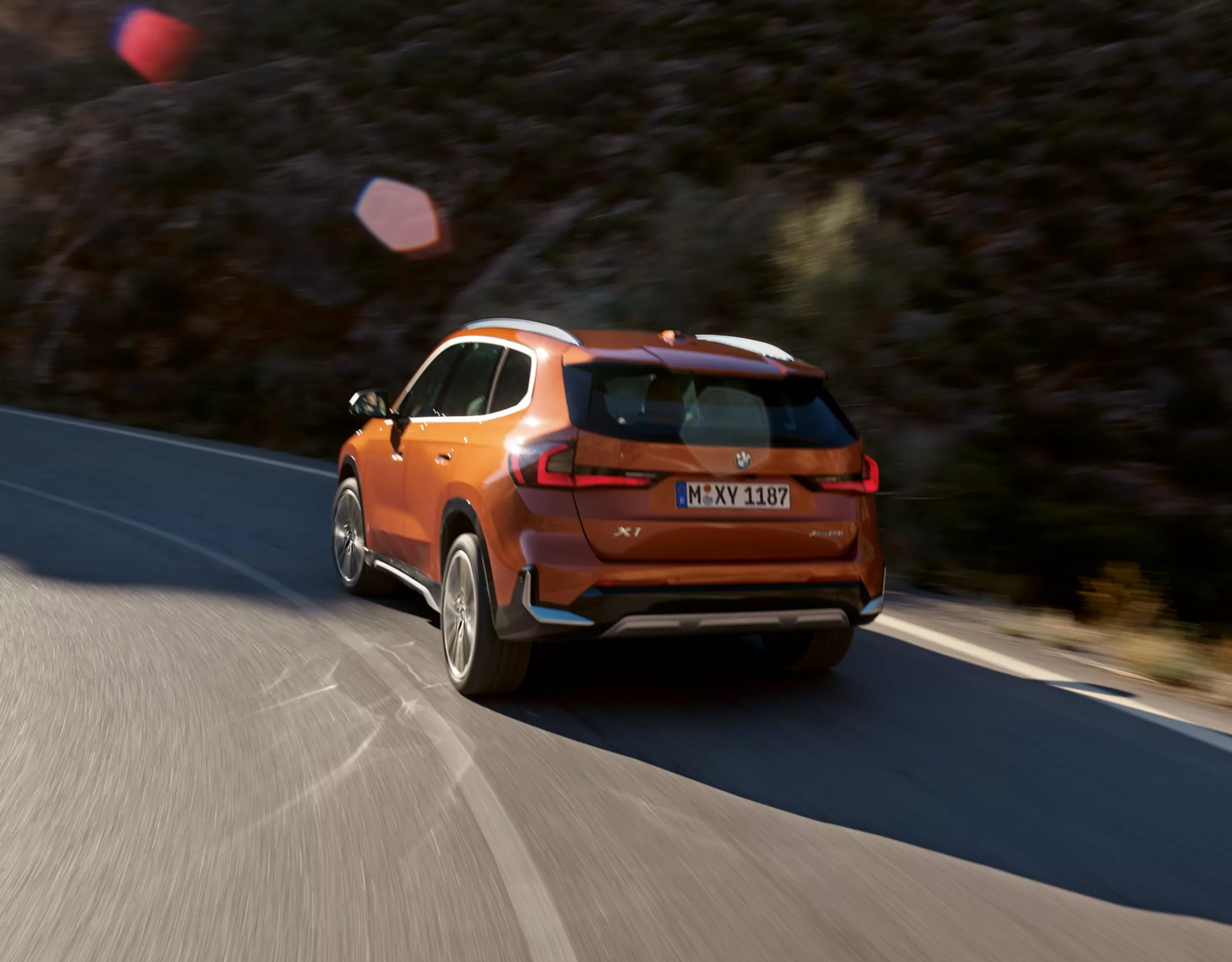 BMW X1 orange rear view 