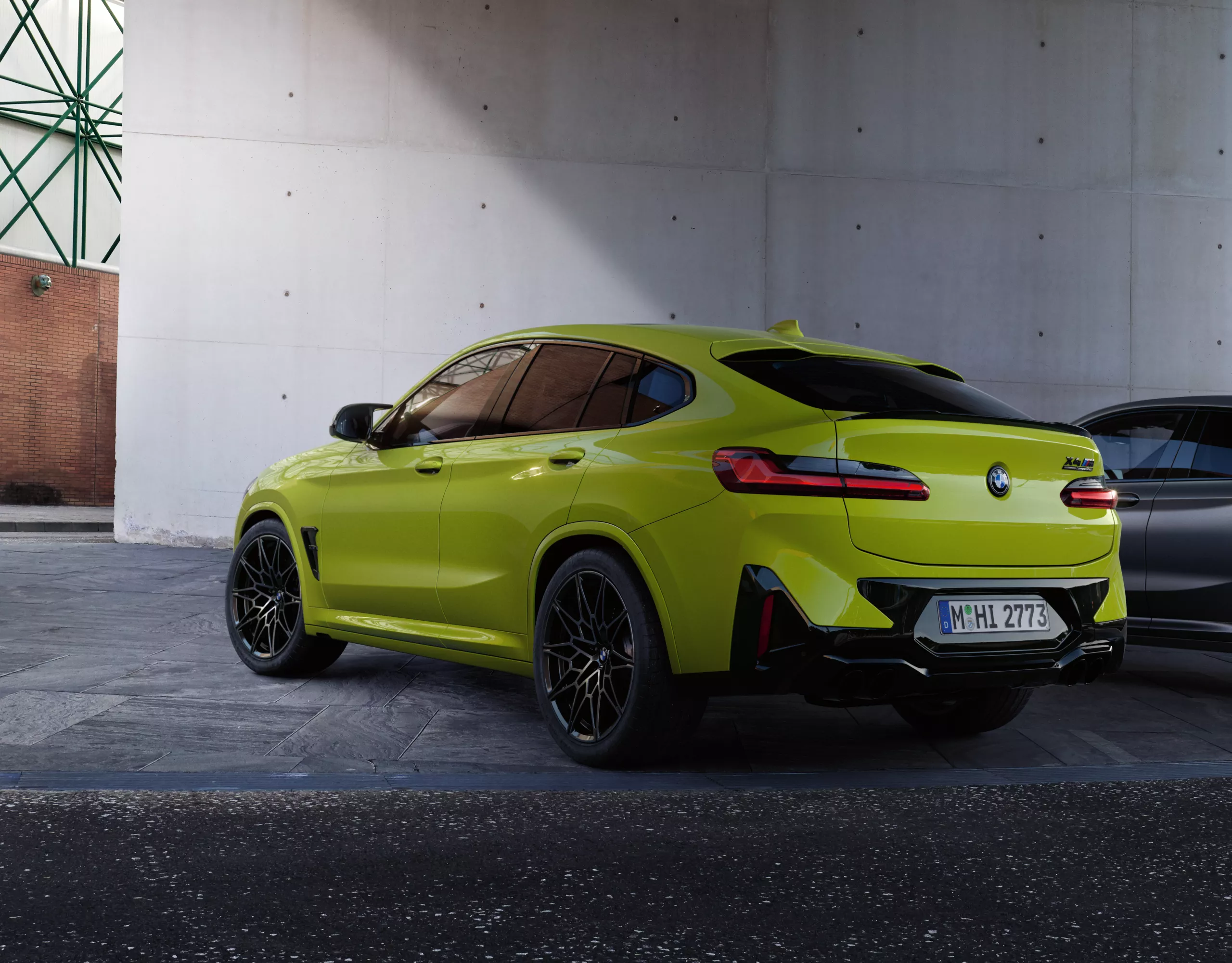 BMW X4 M yellow/grey rear view 