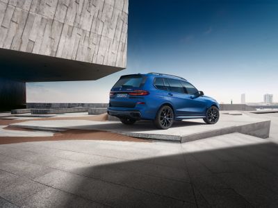 BMW X7 M60i blue rear view