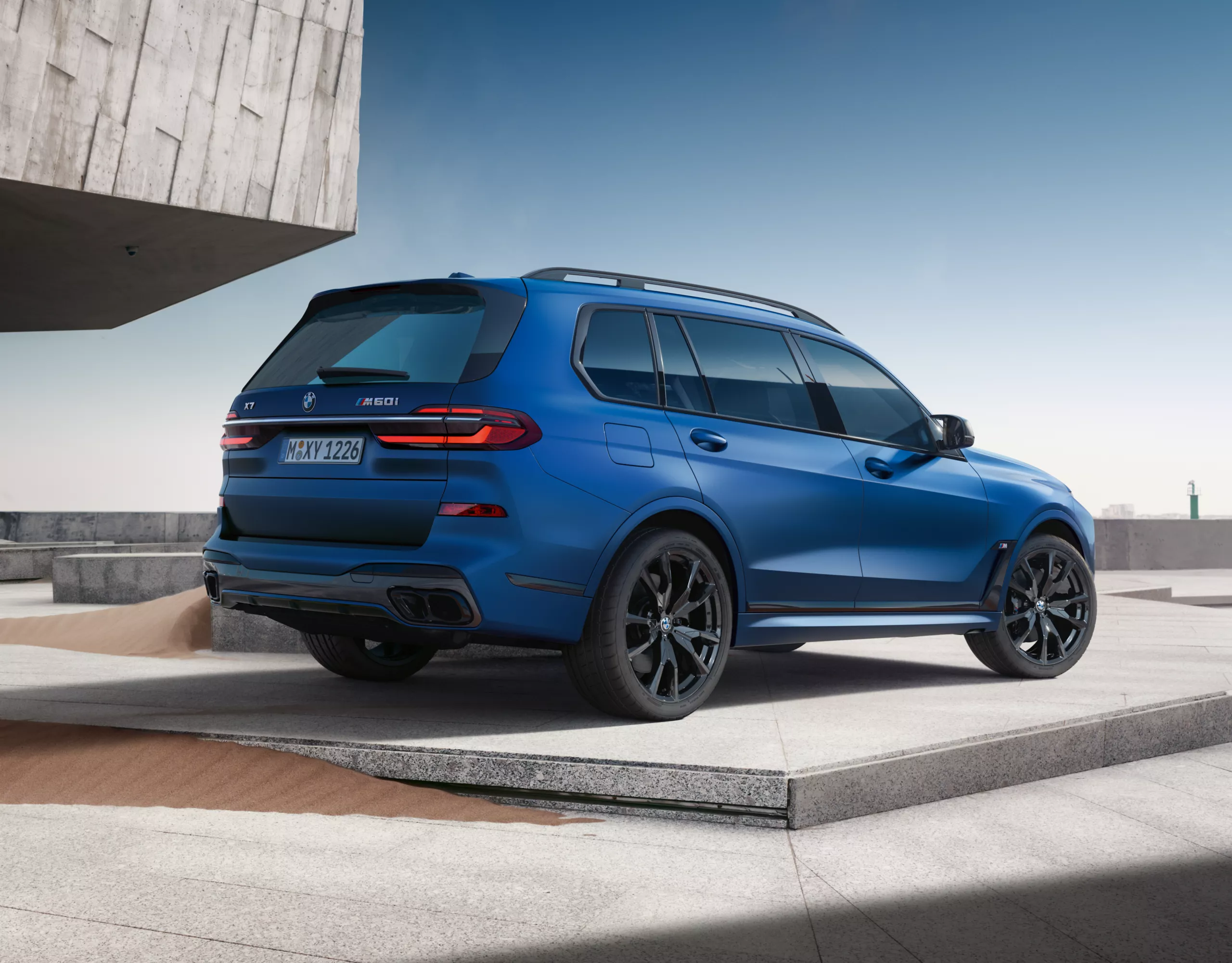 BMW X7 M60i blue rear view