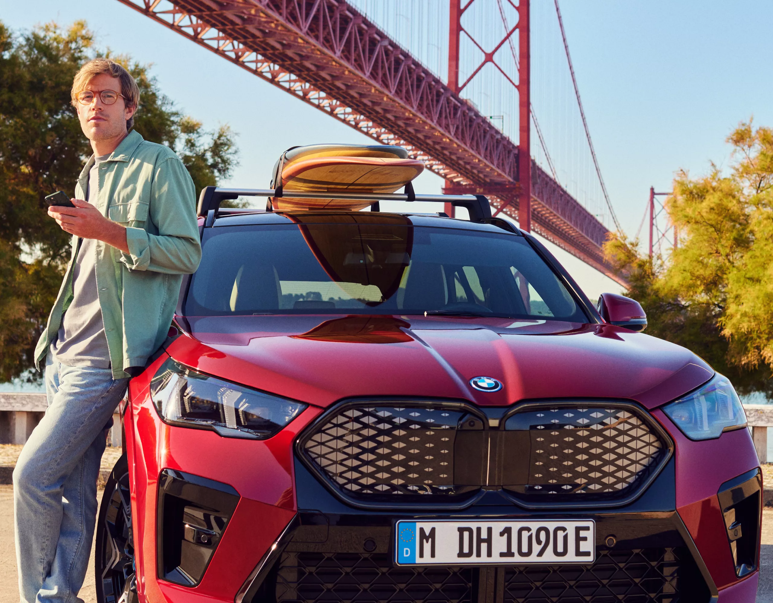 Person sitting in a BMW operating the central information display