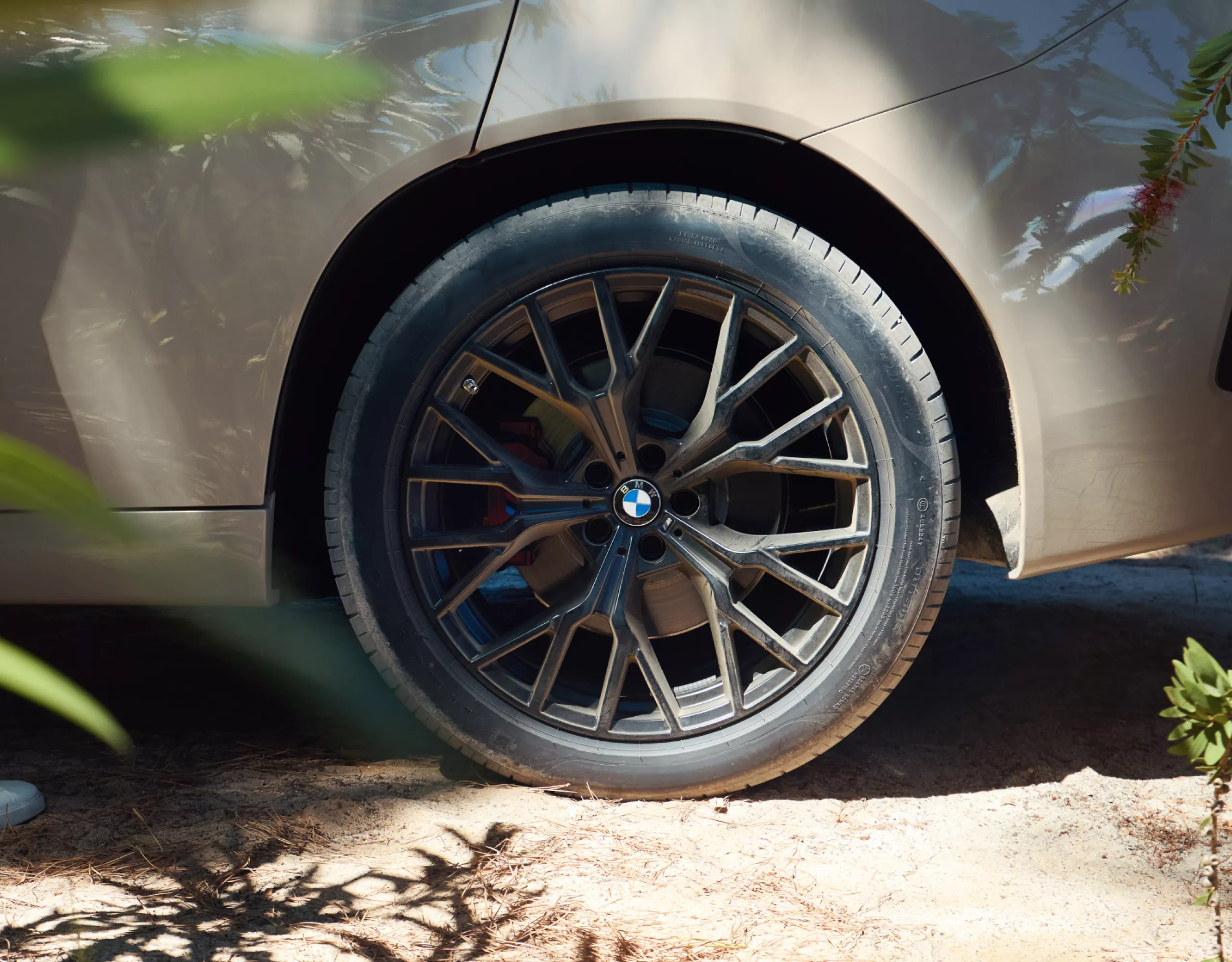 BMW iX3 with a black rim stands on a platform