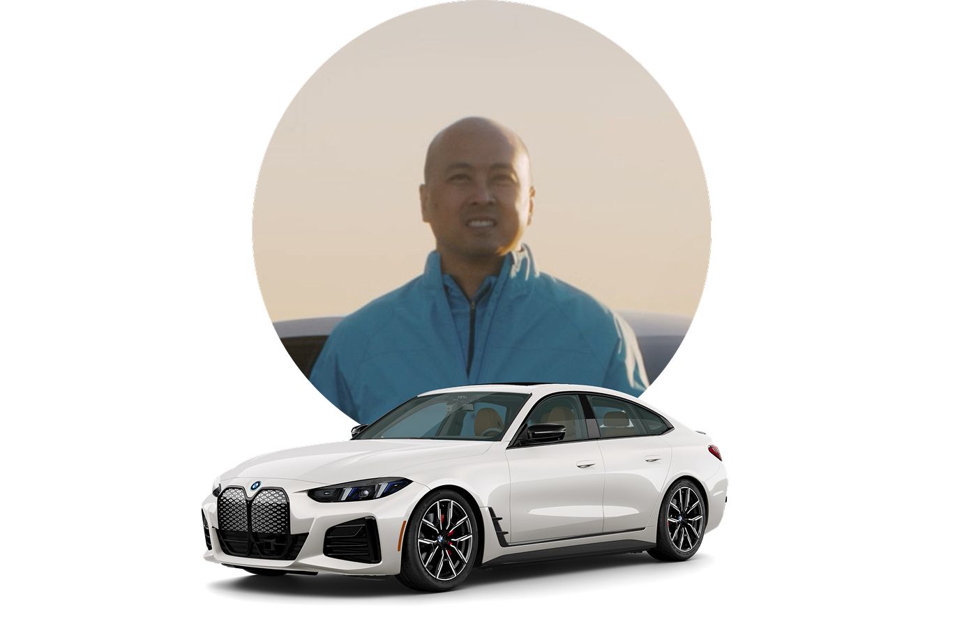 Julius smiles for a photo with an icon of a BMW i4 in front of him.