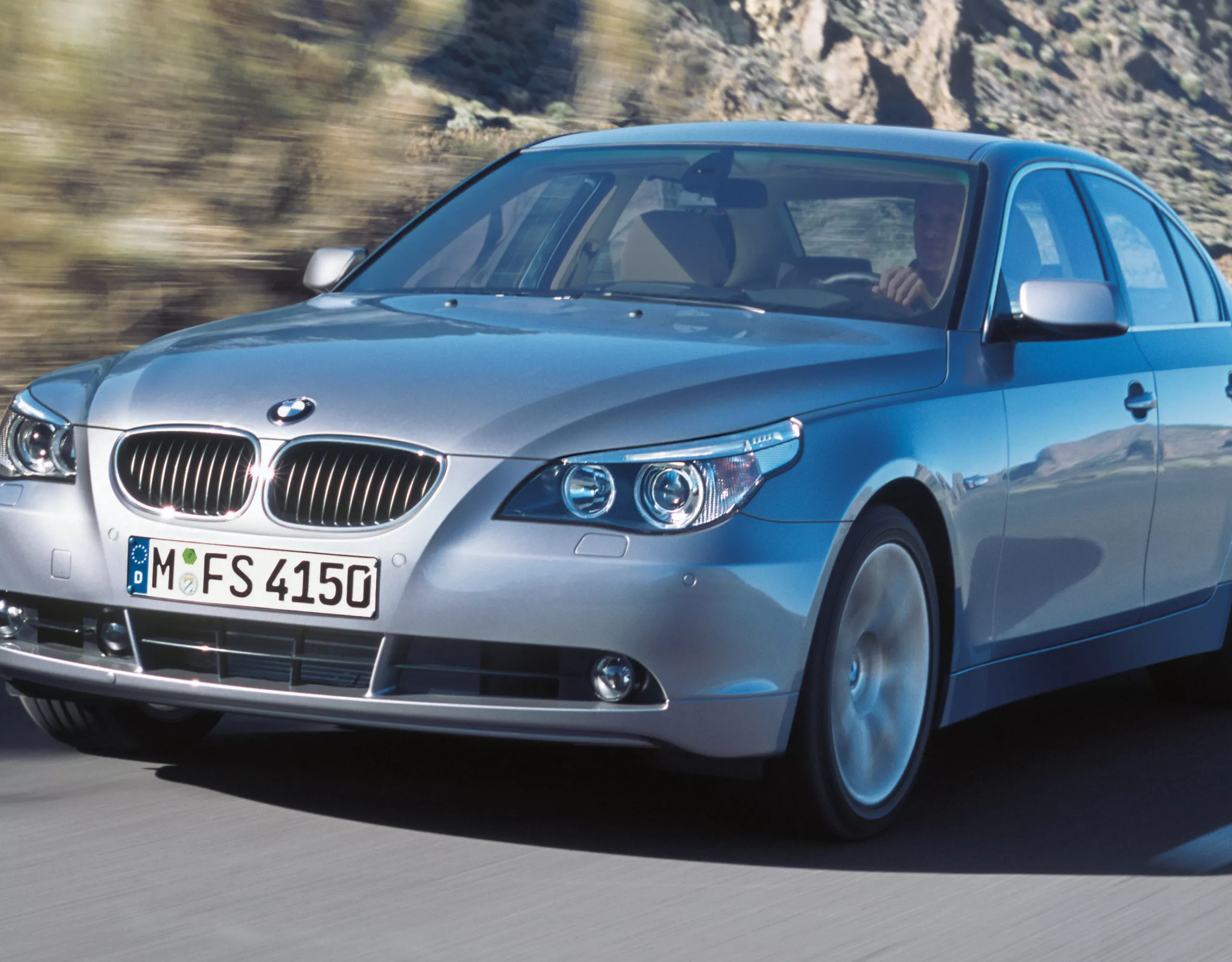 BMW 5 Series Sedan E60 three-quarter frontal view while driving