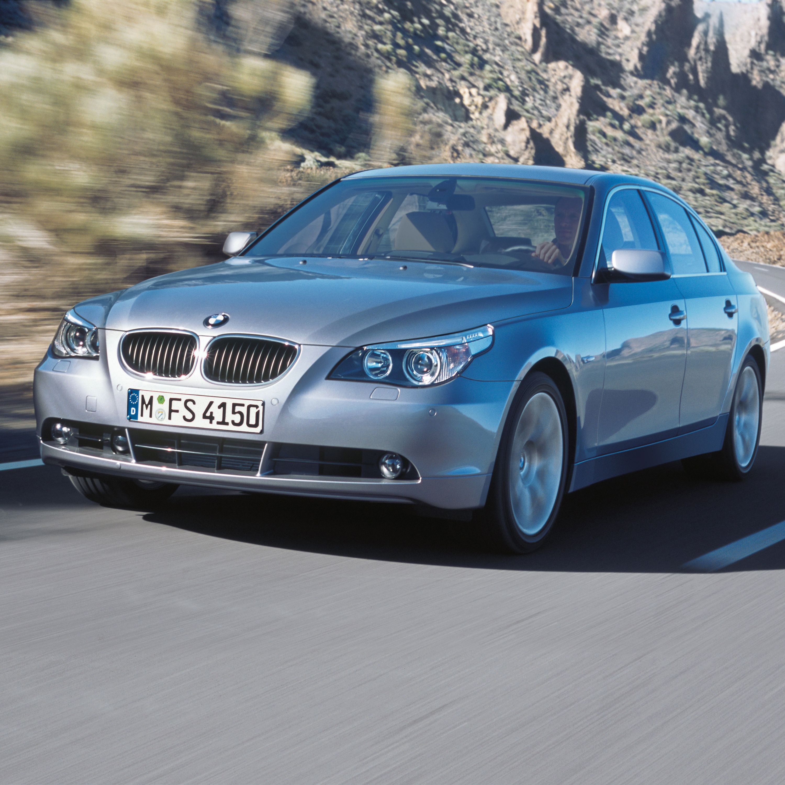 BMW 5 Series Sedan E60 three-quarter frontal view while driving