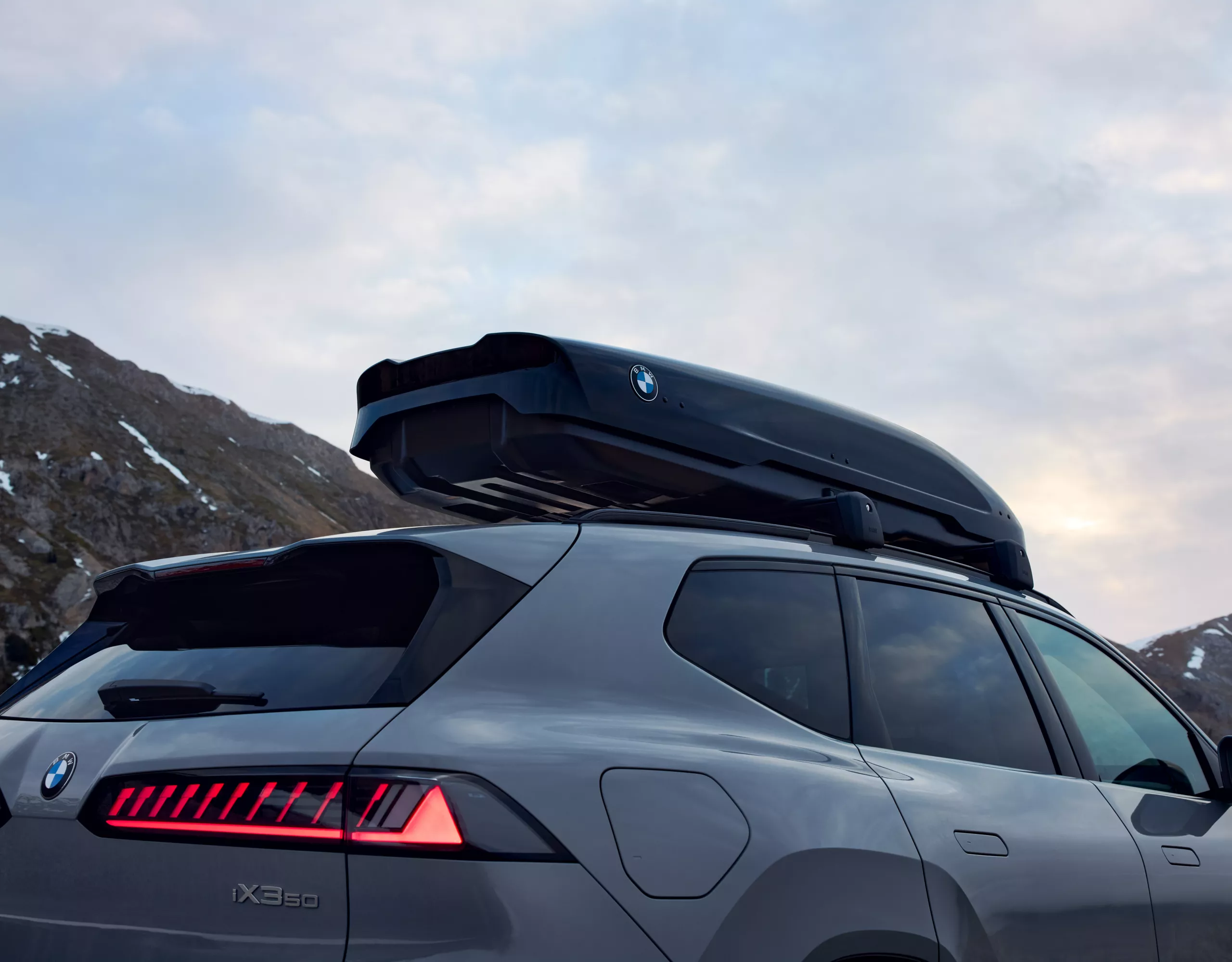 Roof box BMW iX3 50 with mountain panorama