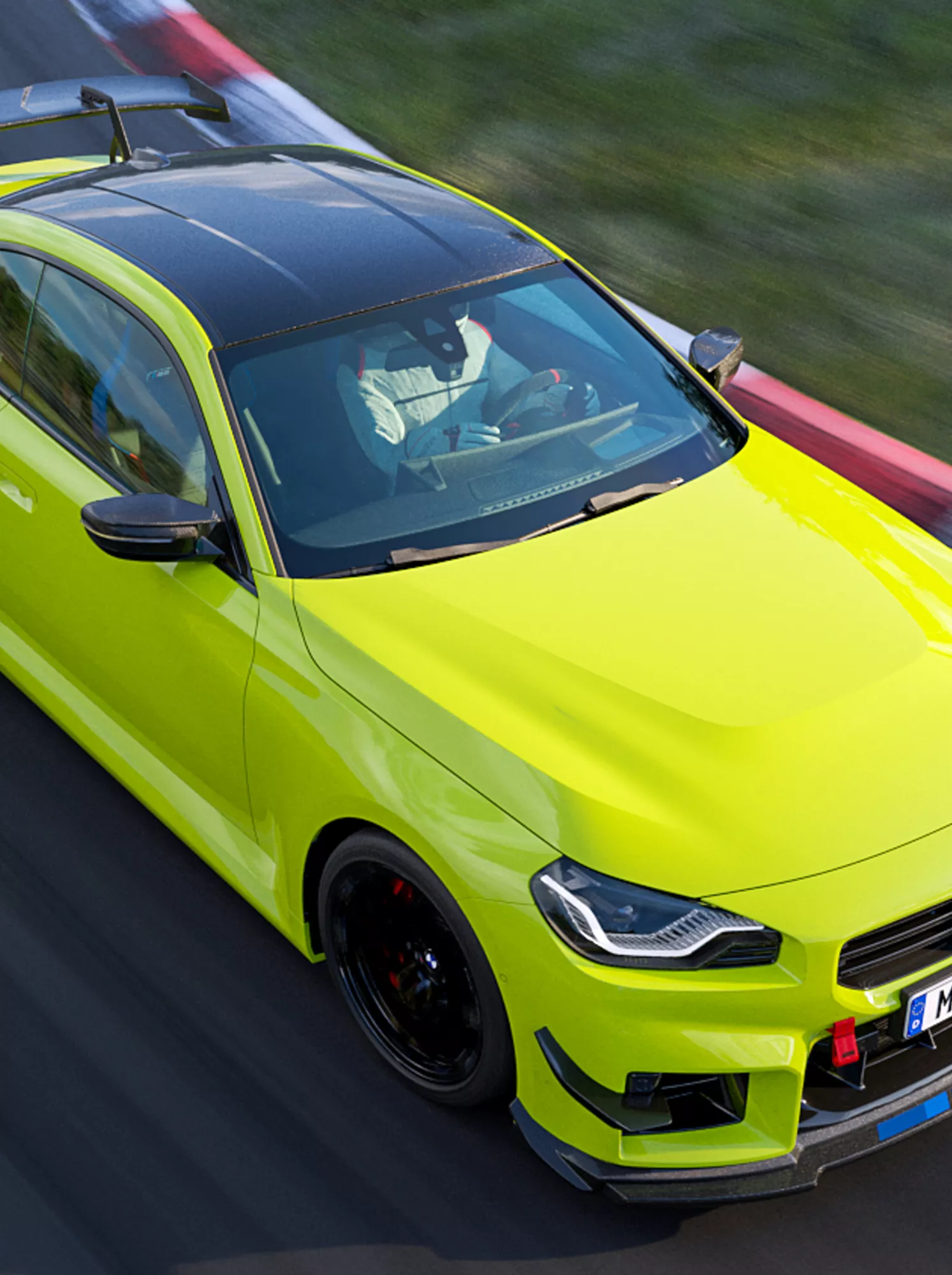 M Performance versenypálya-csomag: a BMW M2 egy versenypálya kanyarjában halad