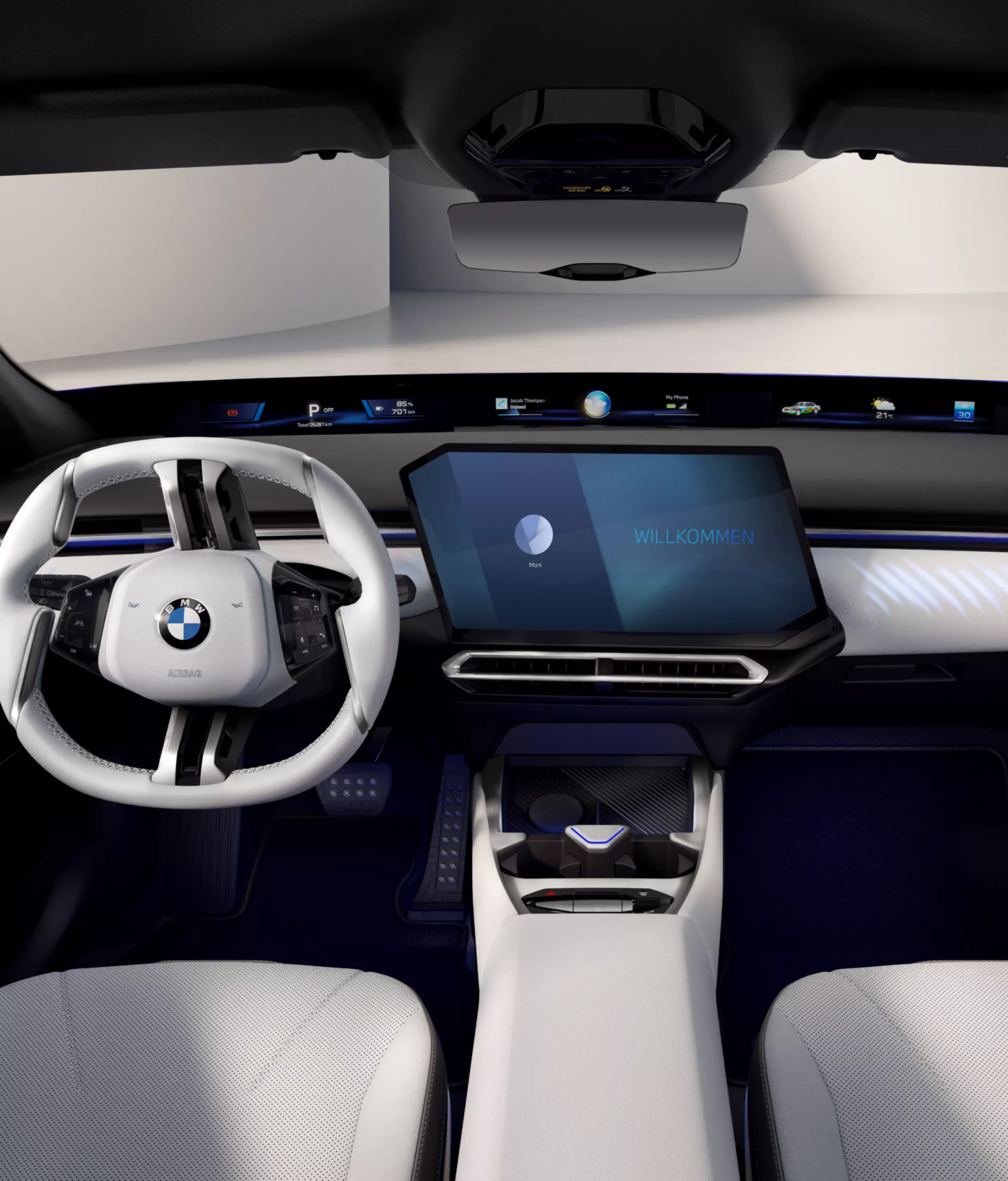Blick vom mittleren Sitz des Fond auf das illuminierte Cockpit mit Zentral-Display im Free-Cut Design. 
