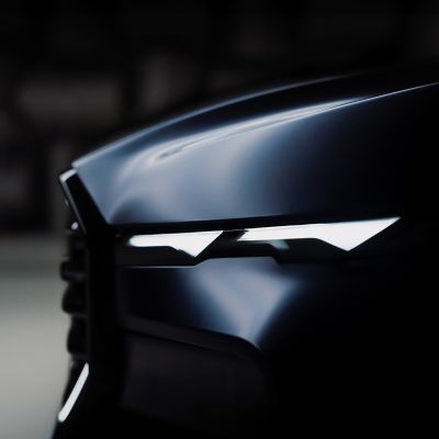 Front section with headlights of a BMW XM Label in BMW Individual matt paint finish