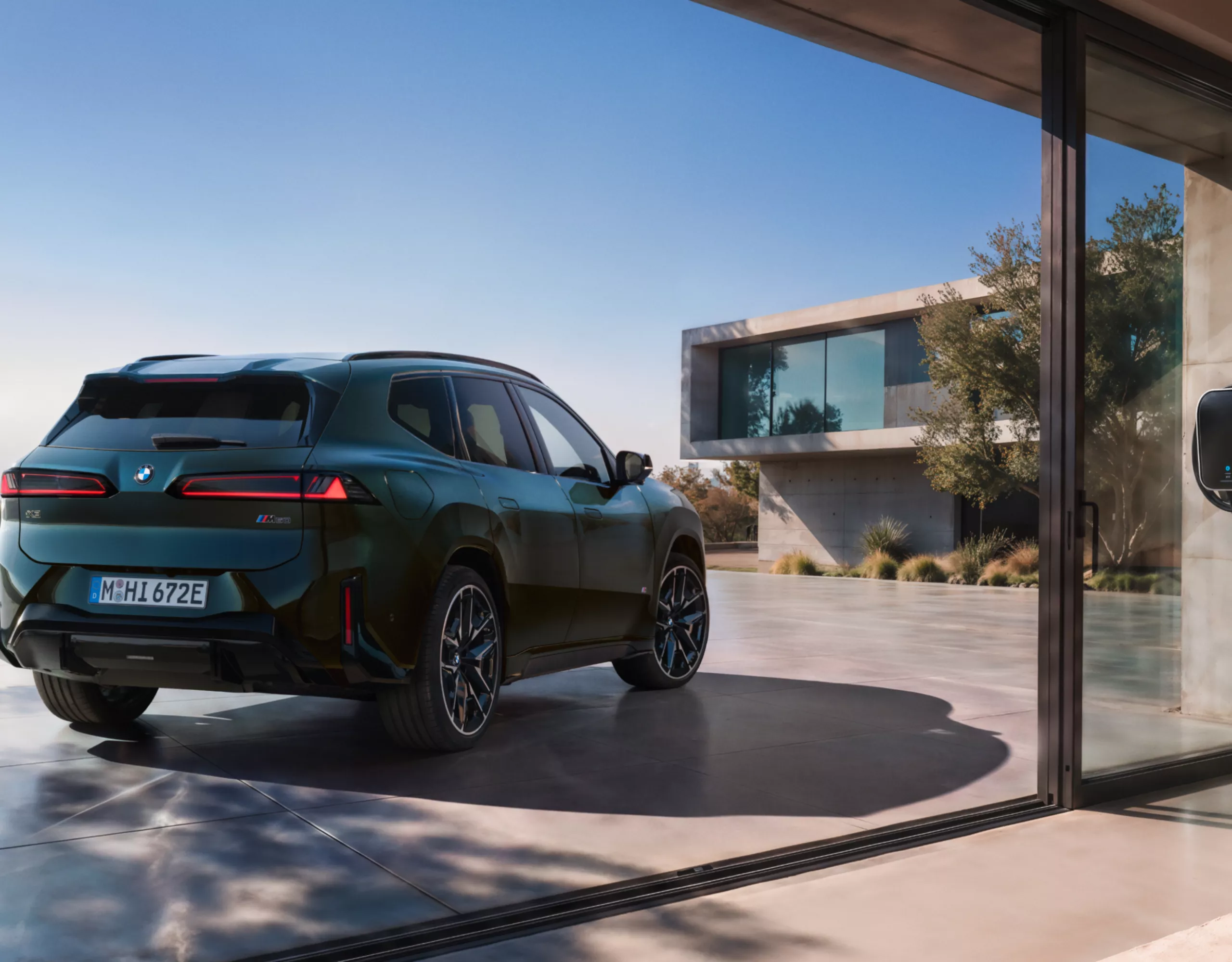 BMW iX3 M60 xDrive in a charging situation at a charging station